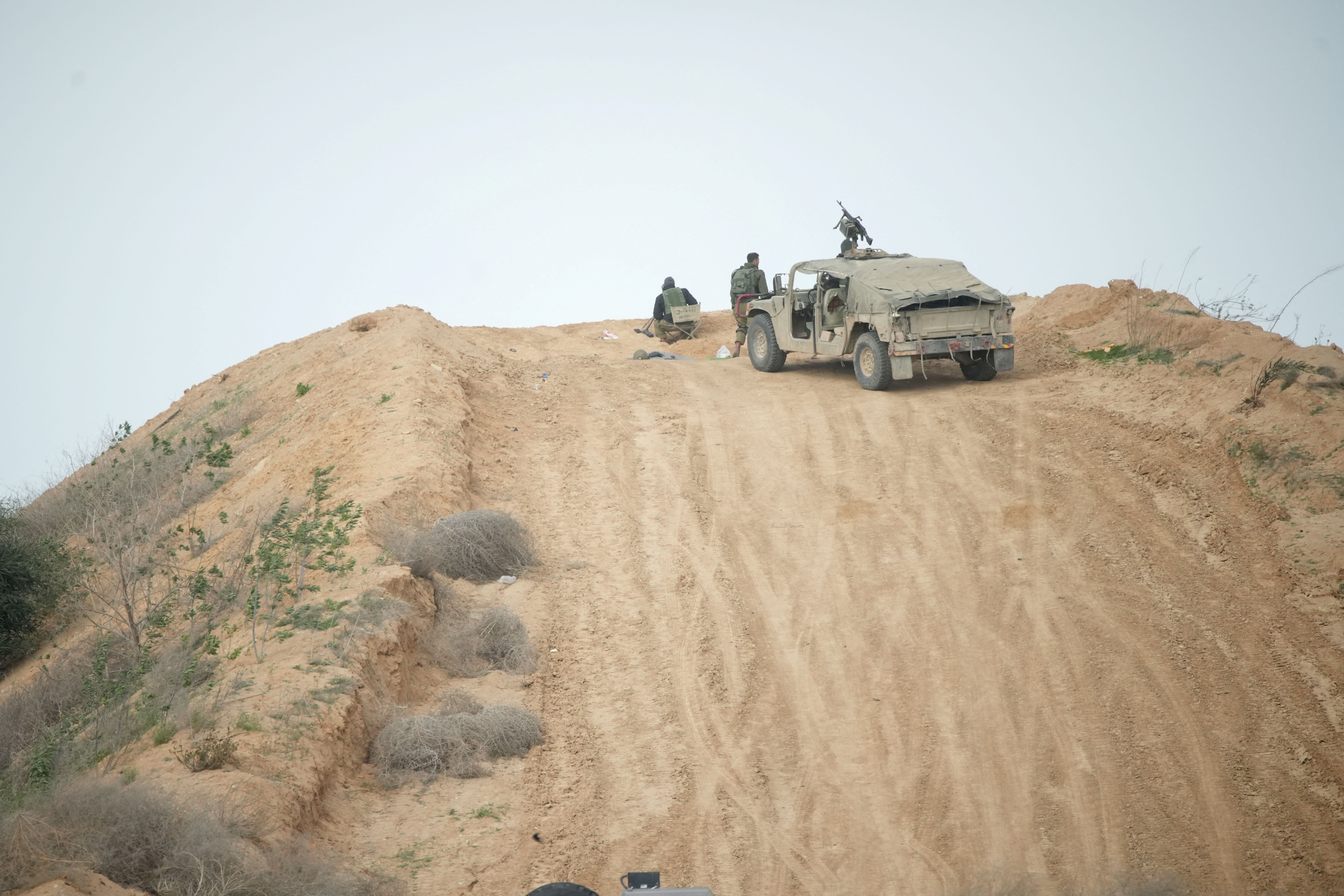Israeli soldiers watch the Israel-Gaza border in southern Israel