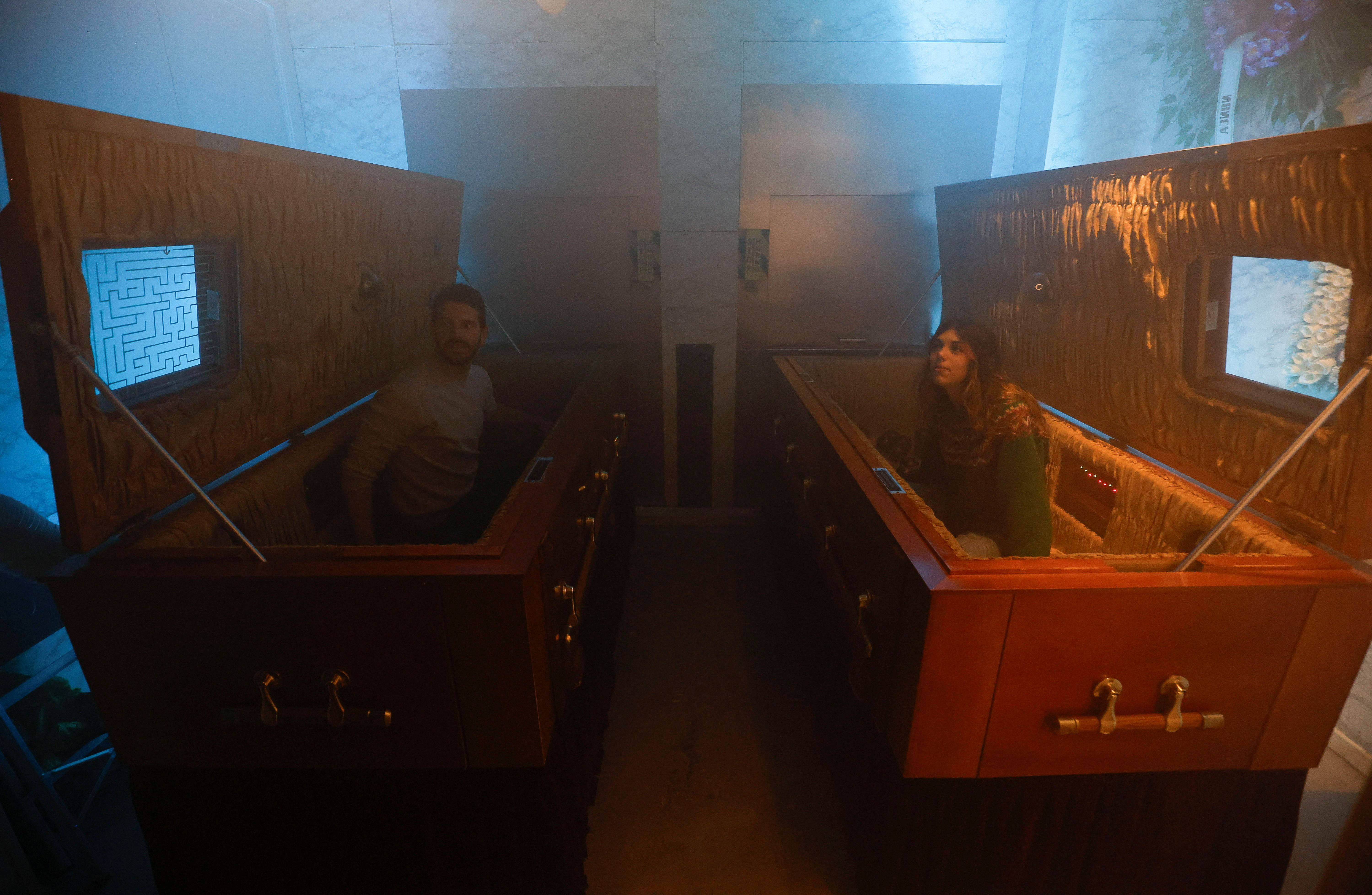 Gamers play an extreme escape room named Catalepsia inside coffins, in Barcelona