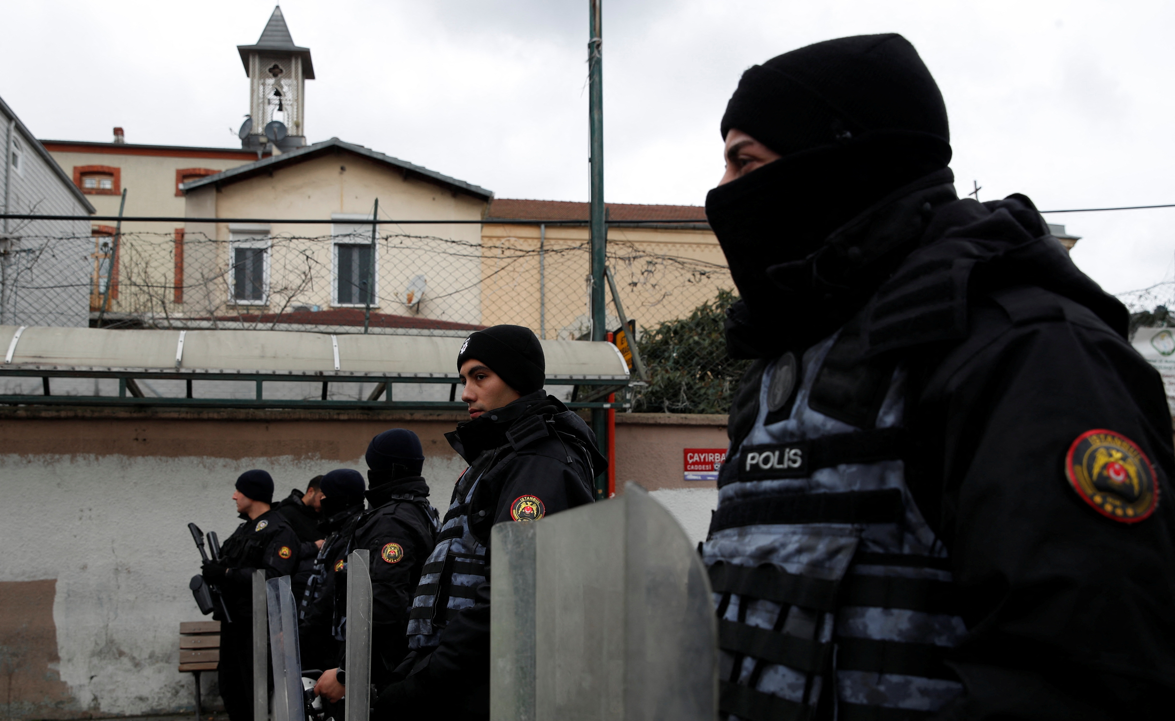 Turkish police stand guard outside the Santa Maria Catholic Church in Istanbul