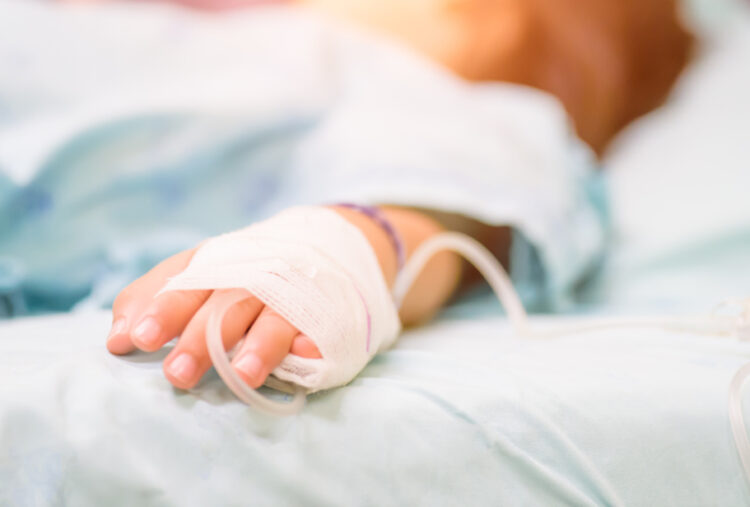 Closeup,Kid,Hand,Sleeps,On,A,Bed,In,Hospital,With