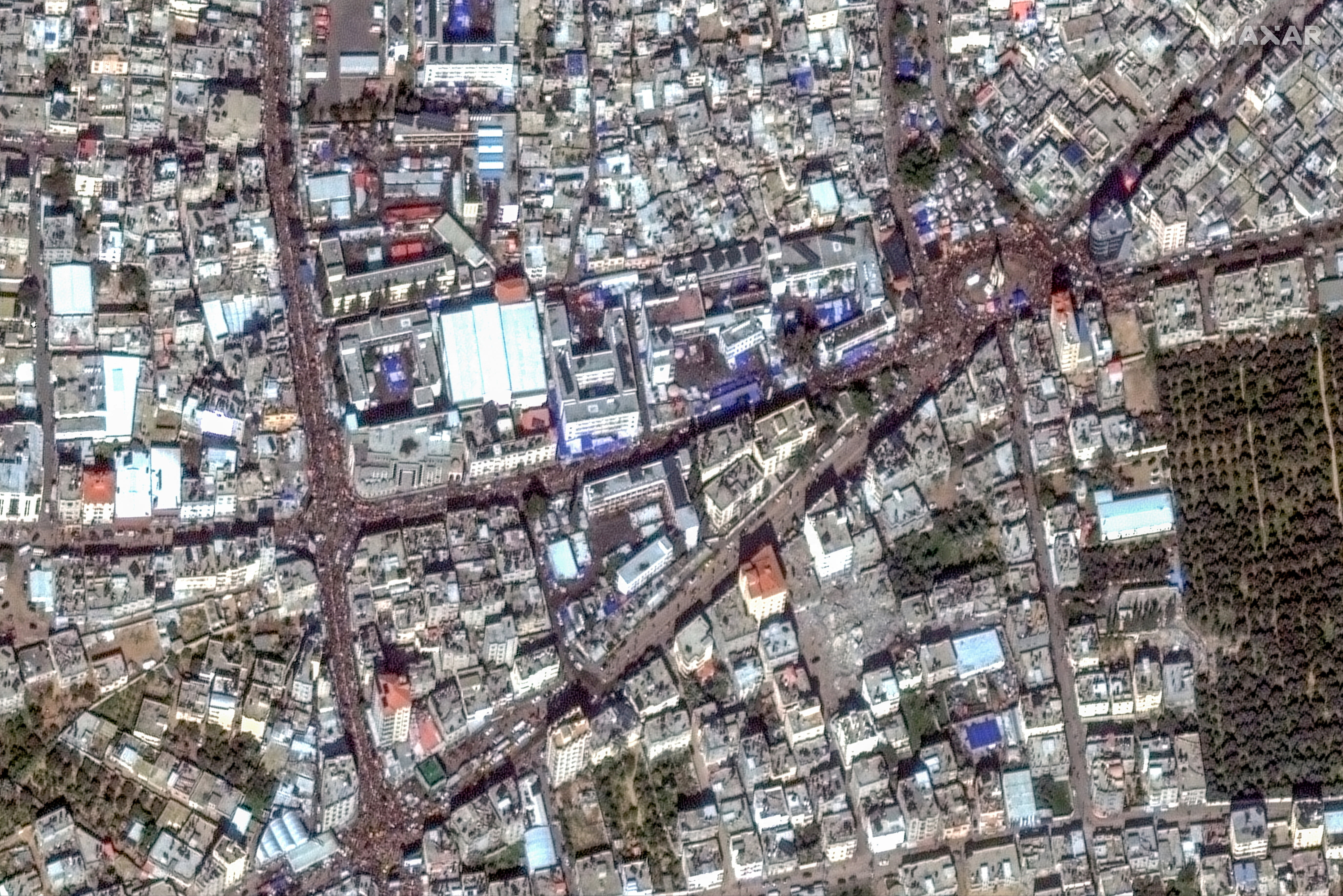 A satellite image shows people gathering on the streets in Rafah