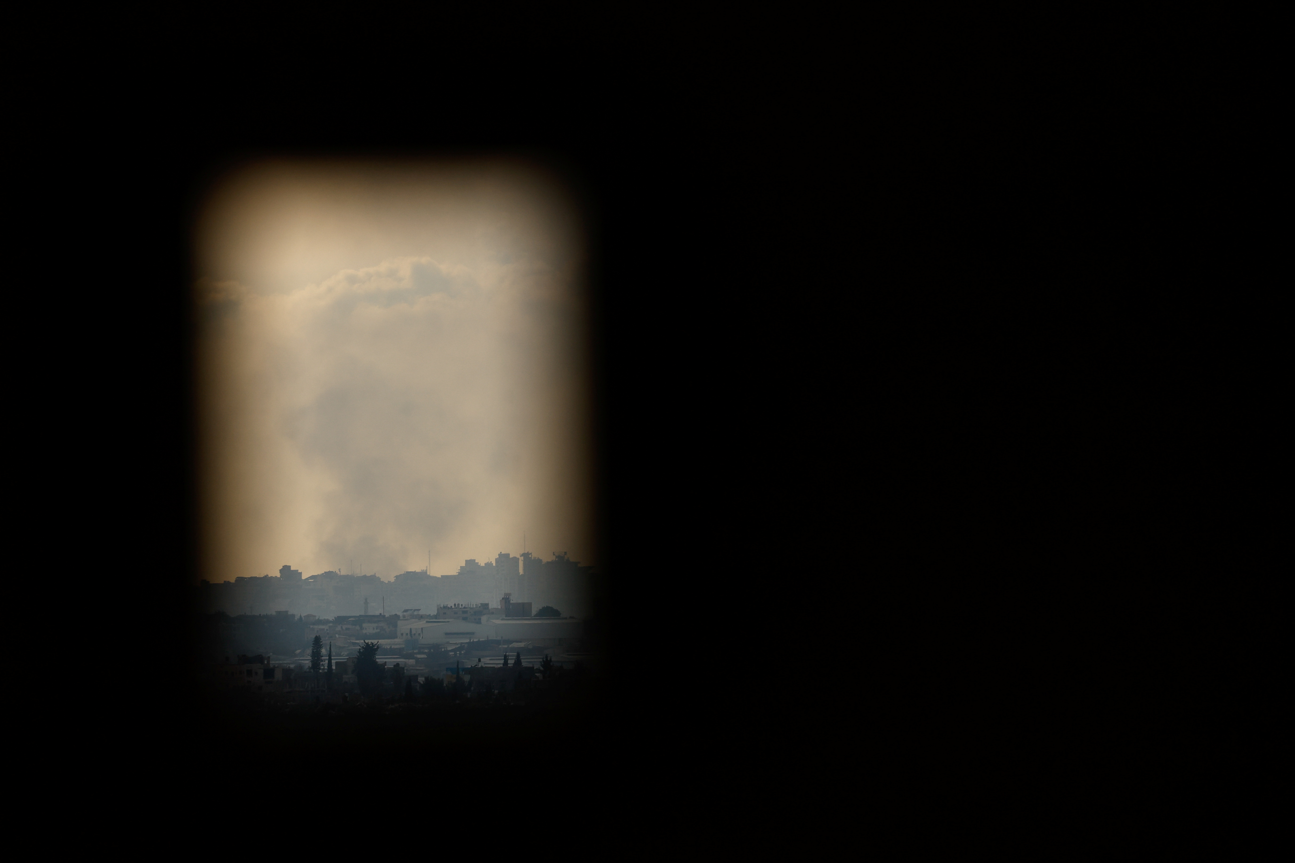 Smoke rises over Gaza, as seen from Israel