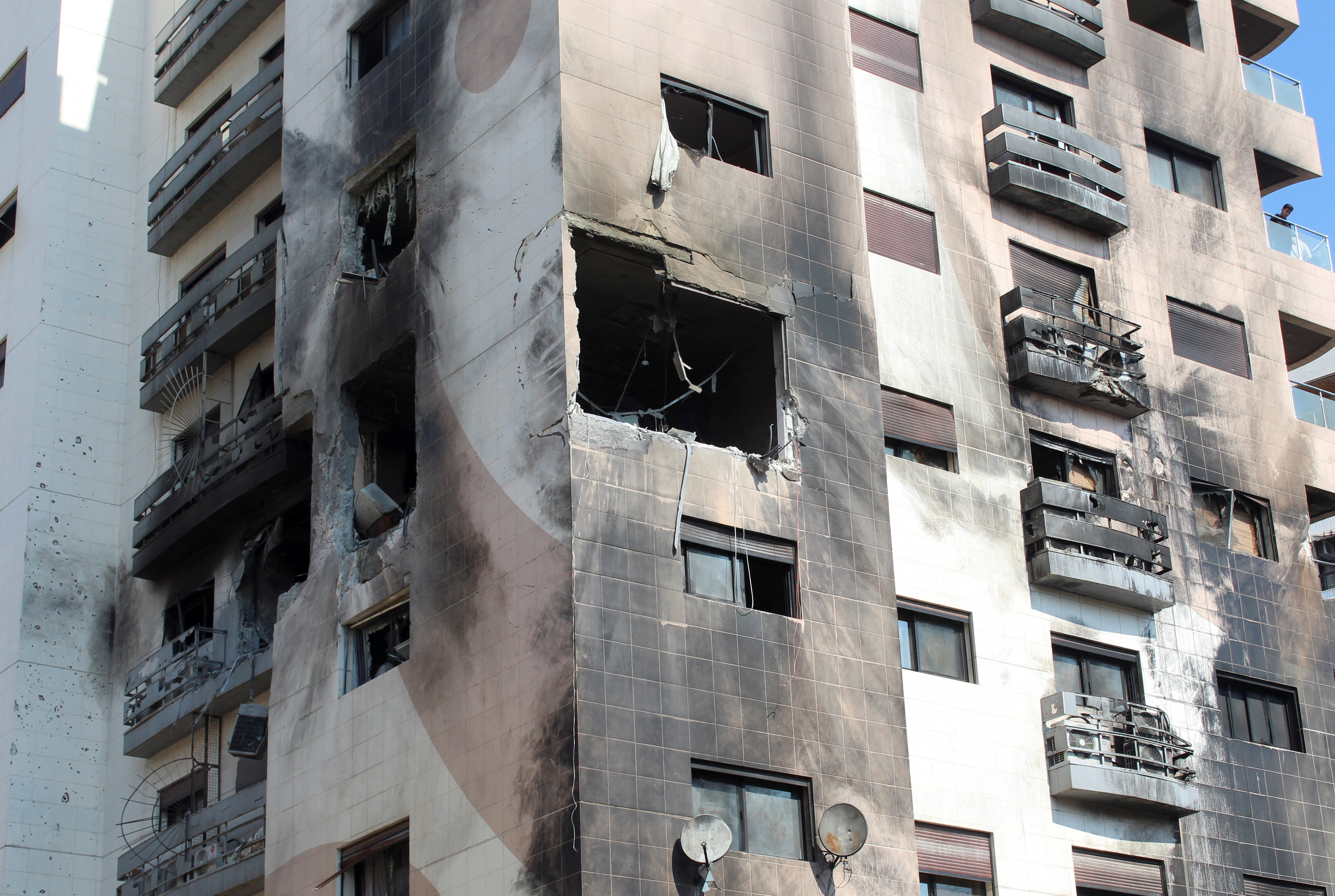 A view shows a damaged building in the Kafr Sousa district of Damascus