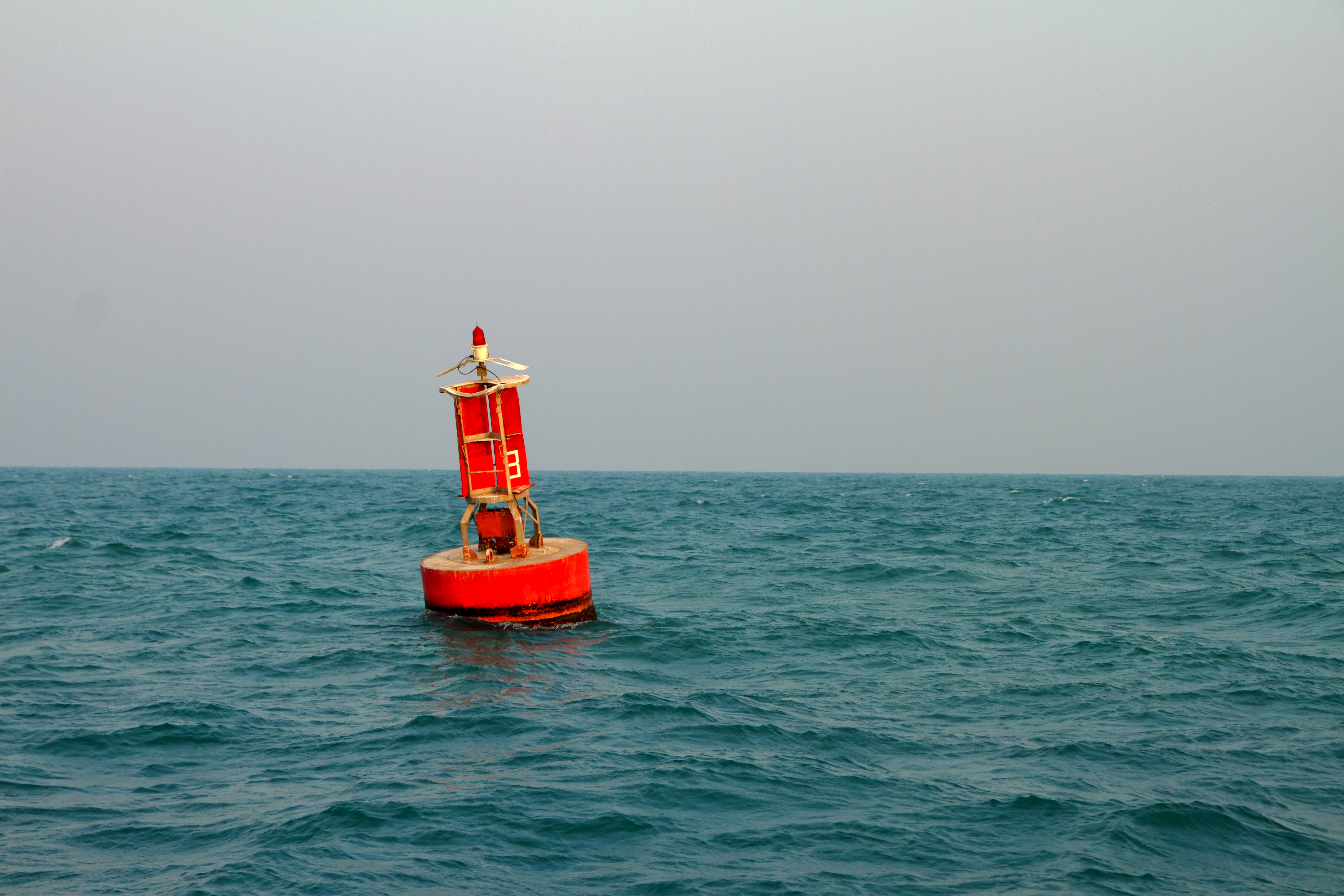 Floating,Red,Navigational,Buoy,On,Blue,Sea,gulf,Of,Thailand.
