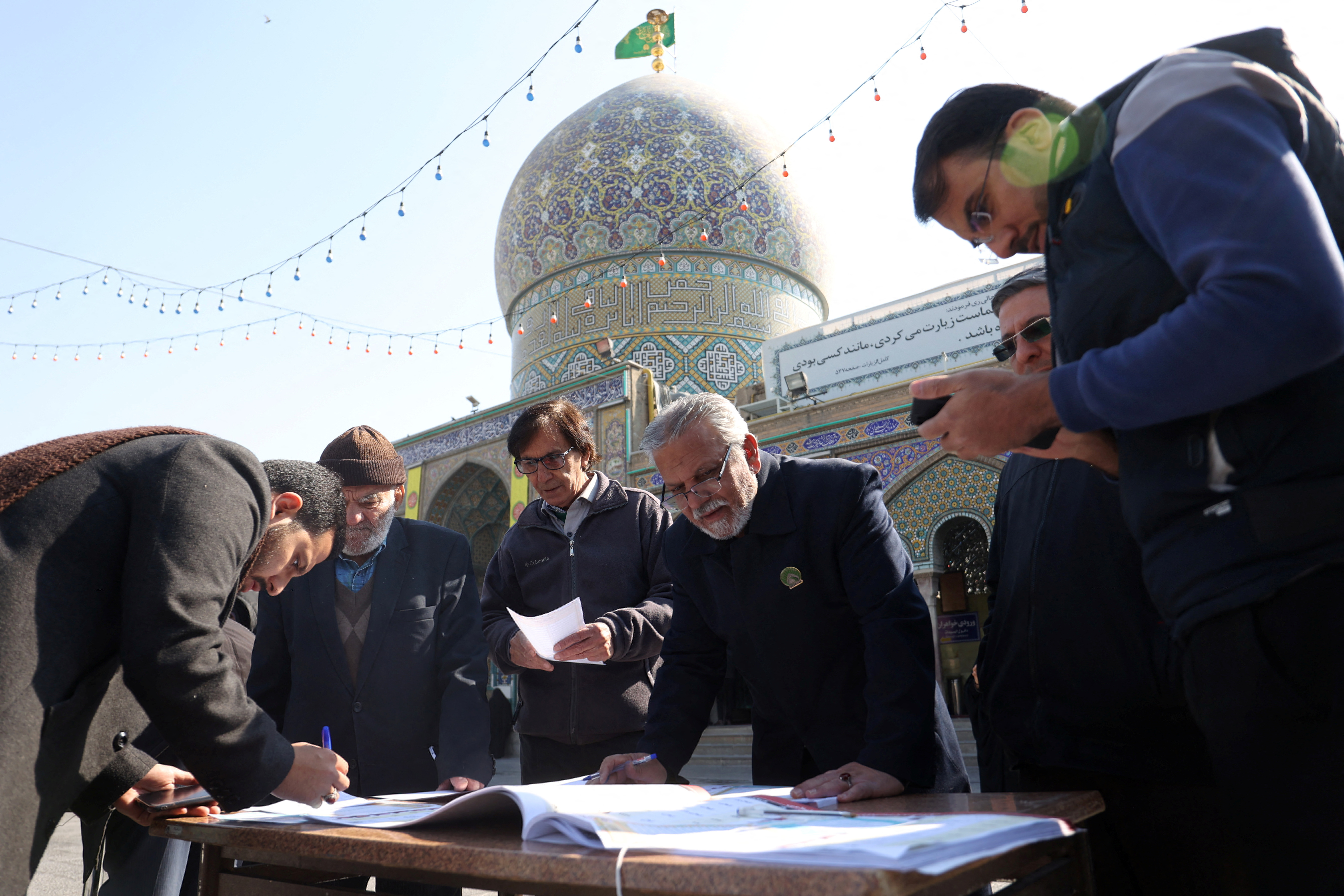 Iranians vote during parliamentary elections at a polling station in Tehran
