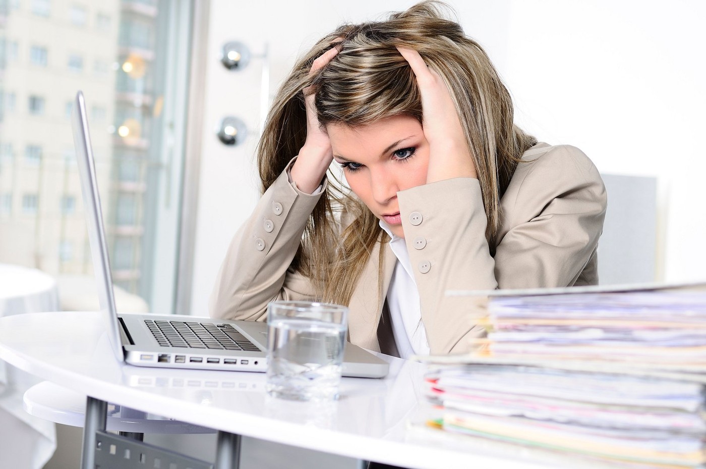 stressed woman working on computer
