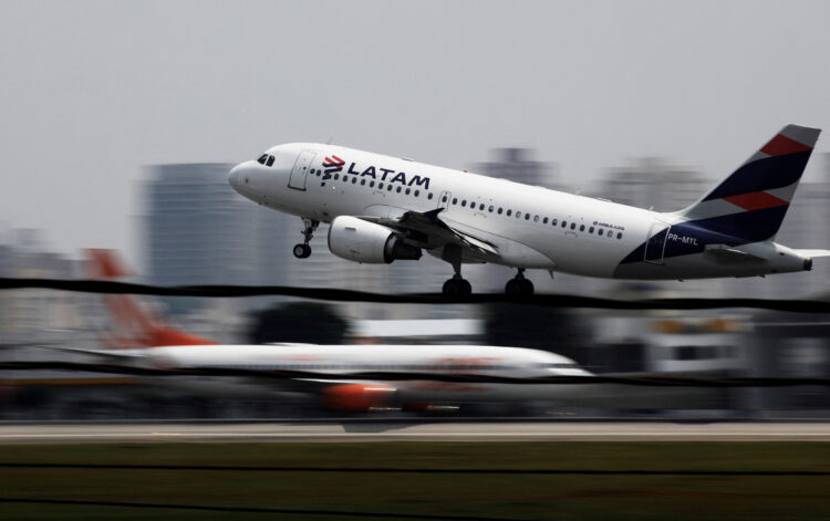 FILE PHOTO: A LATAM Airlines Brasil Airbus A319 plane takes off from Congonhas airport in Sao Paulo, Brazil