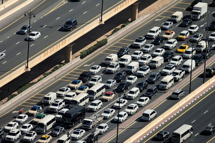 Lanes of a wide city street with lots of cars. traffic jam on the road.