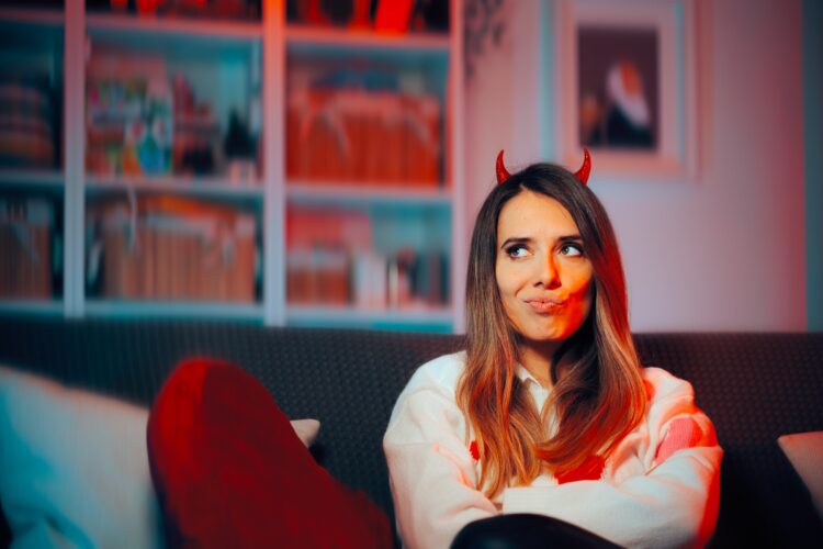 Funny,Mean,Girl,Wearing,Devil,Horns,Making,Malicious,Plans.,Scheming