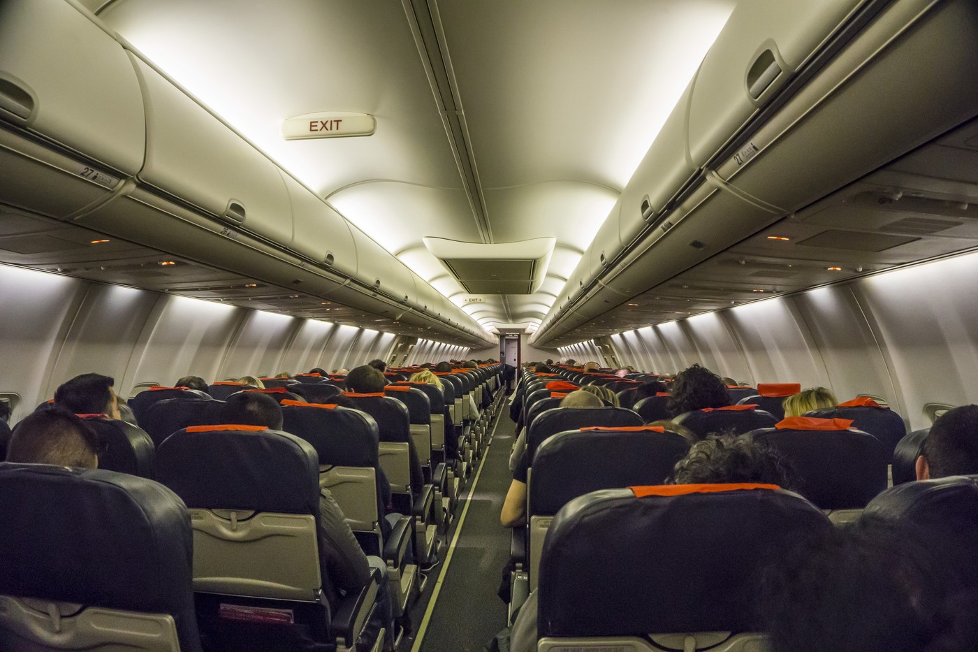 airplane,internal,norway,people,person,plane,red,seats,air,travel,horizontal