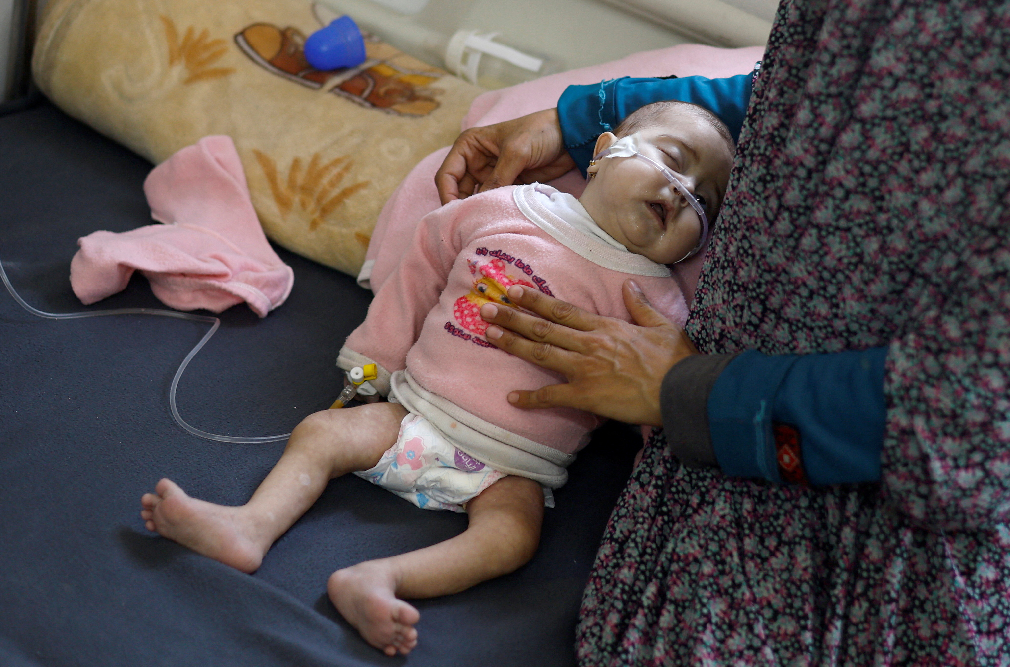 Palestinian children suffering from malnutrition receive treatment at al-Awda health centre, in Rafah, southern Gaza Strip