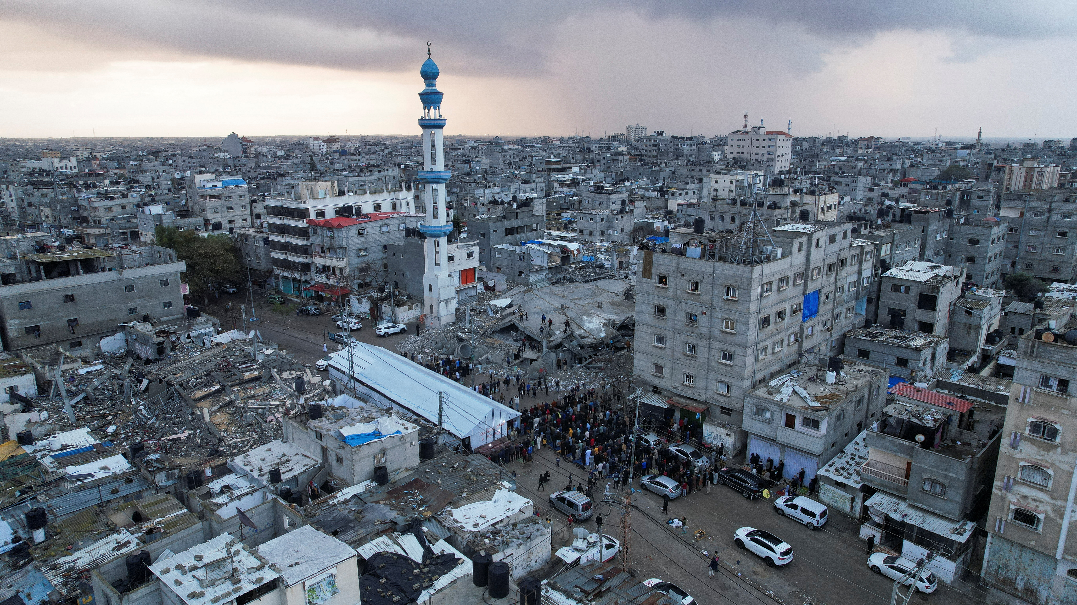 Palestinians hold Eid al-Fitr prayers by the ruins of al-Farouk mosque in Rafah