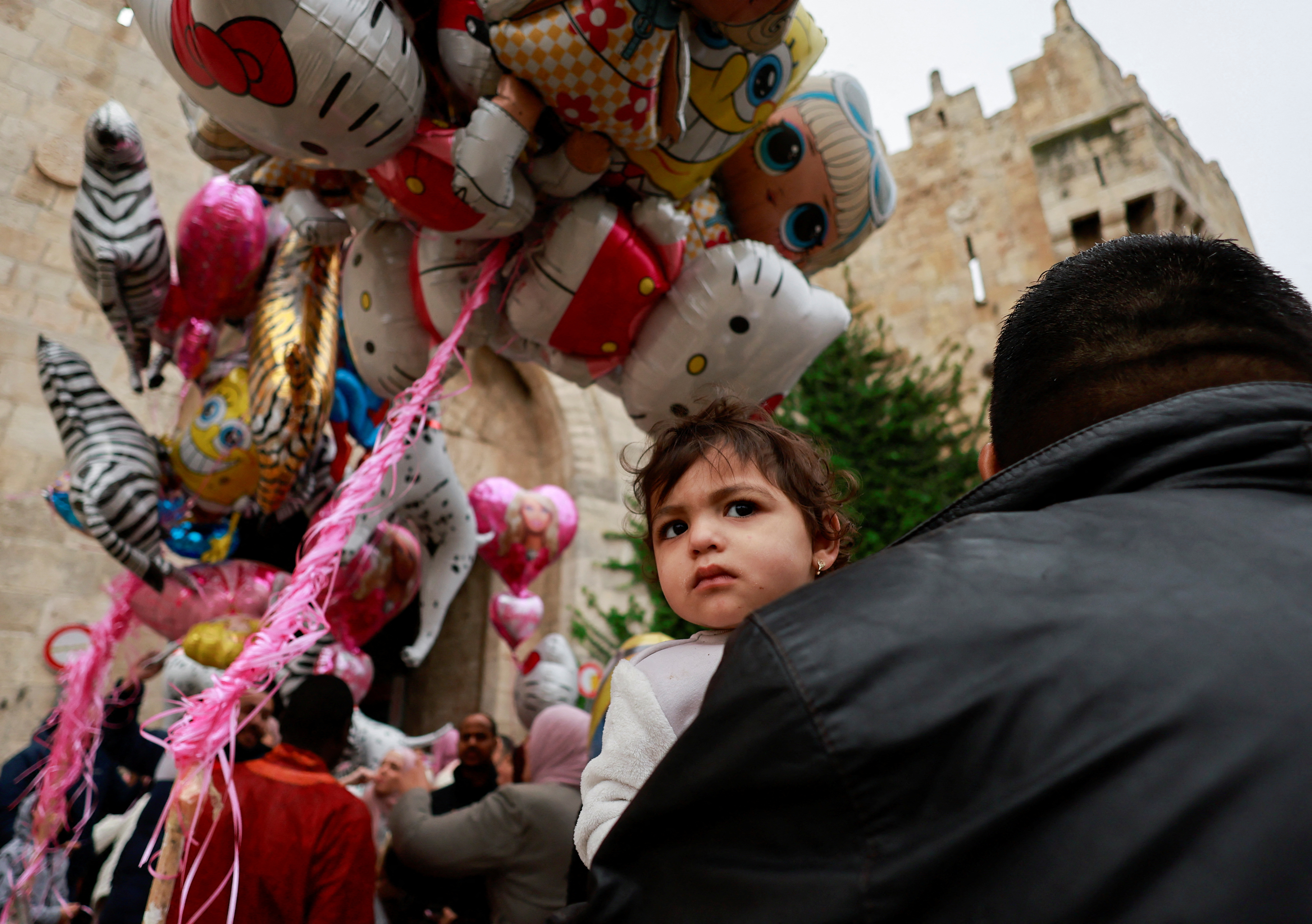 Palestinian Muslims attend Eid al-Fitr prayers which mark the end of Ramadan in Al-Aqsa compound