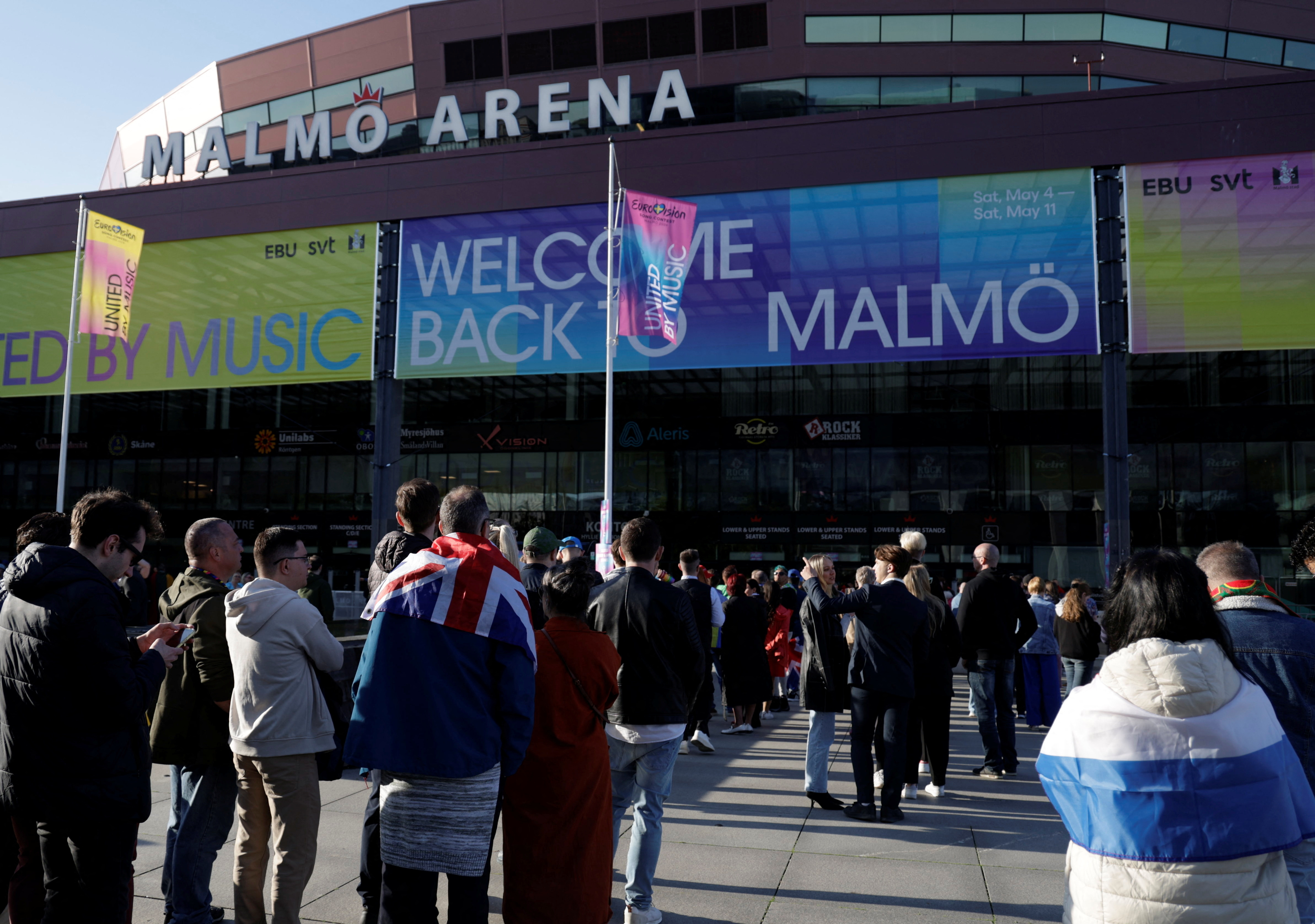 Fans queue for the Eurovision Song Contest semi final 1 outside the Malmo Arena