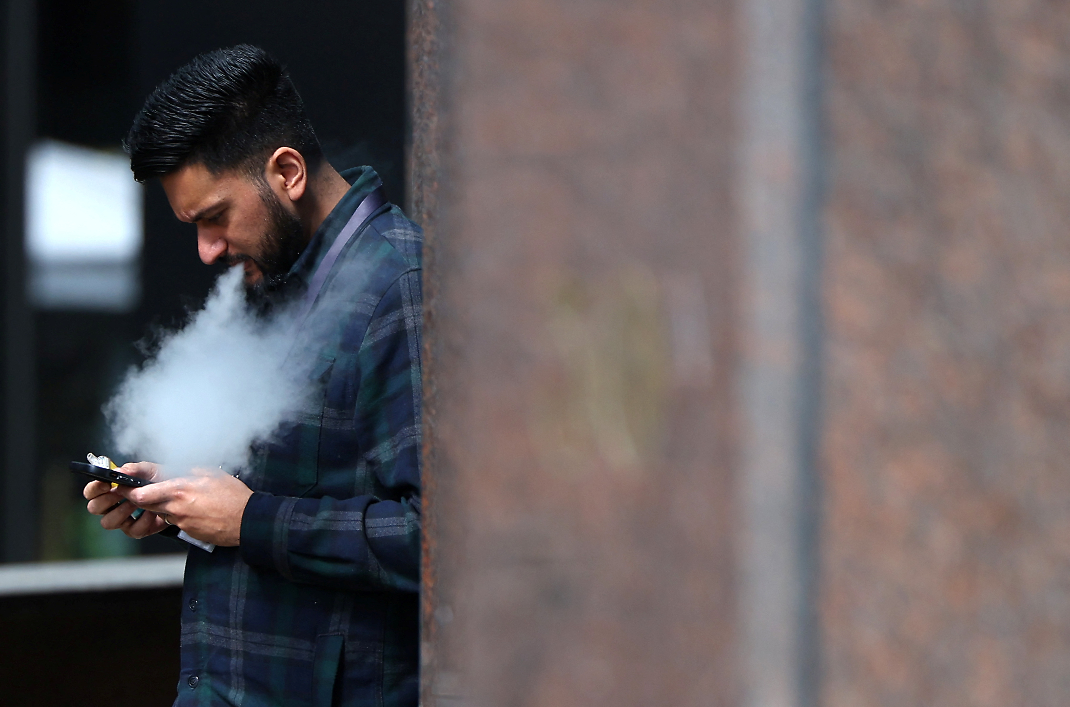 A person vapes in London