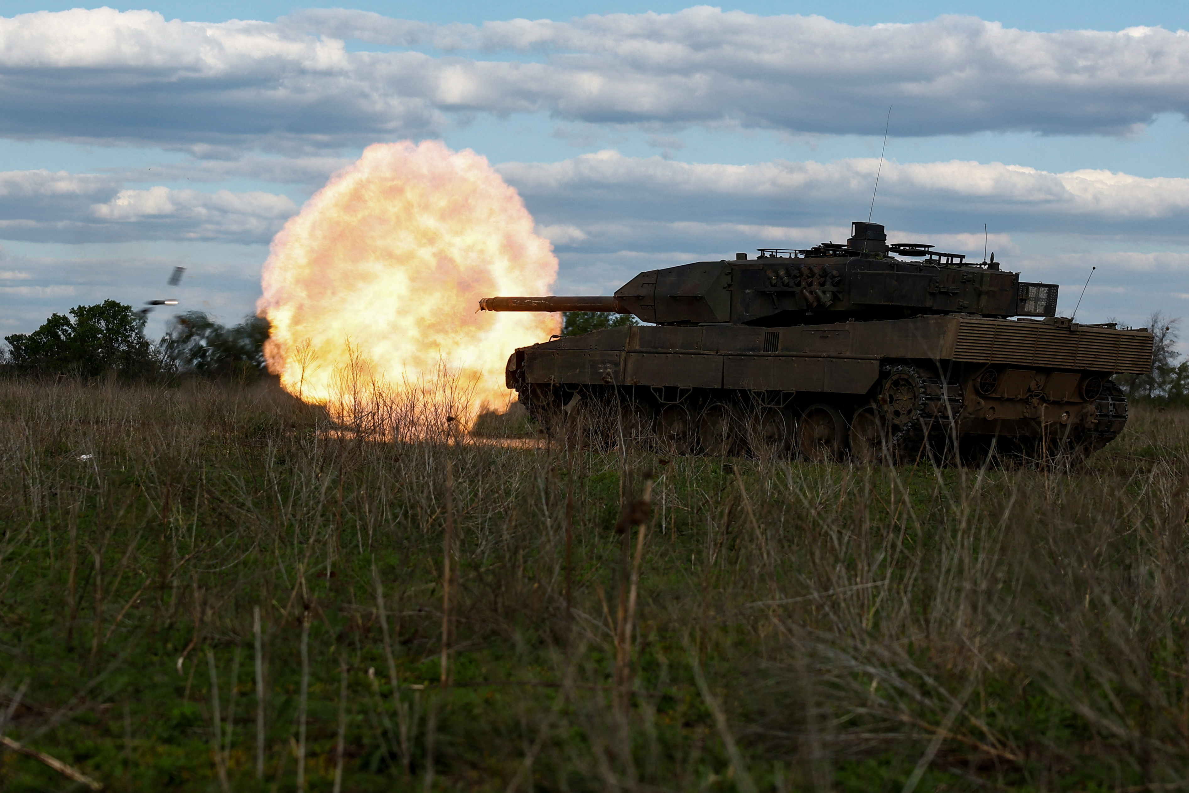 Ukrainian servicemen fire a Leopard 2A6 tank during a military exercise in Donetsk region