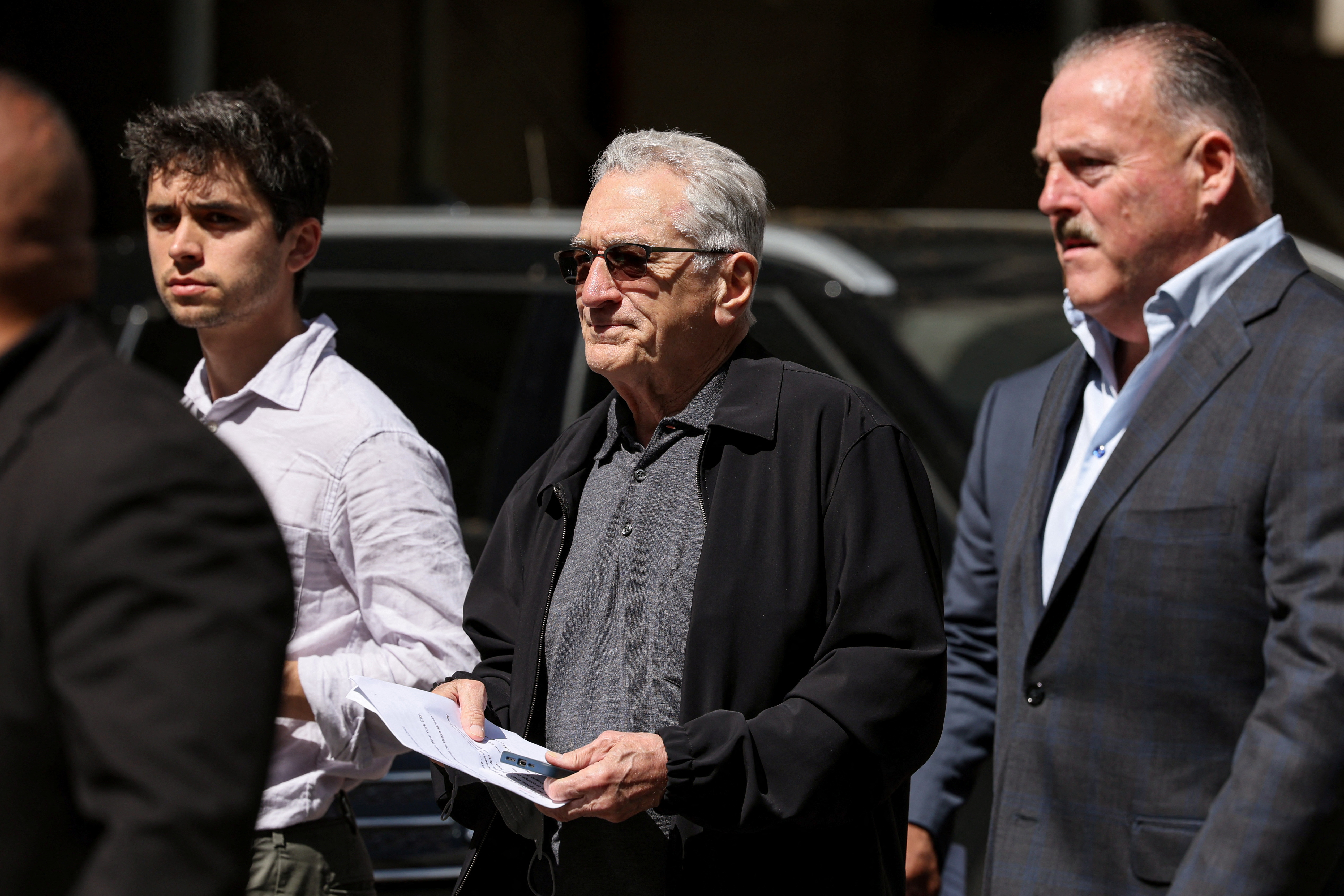 Actor Robert De Niro speaks during a news conference outside Trump trial in New York