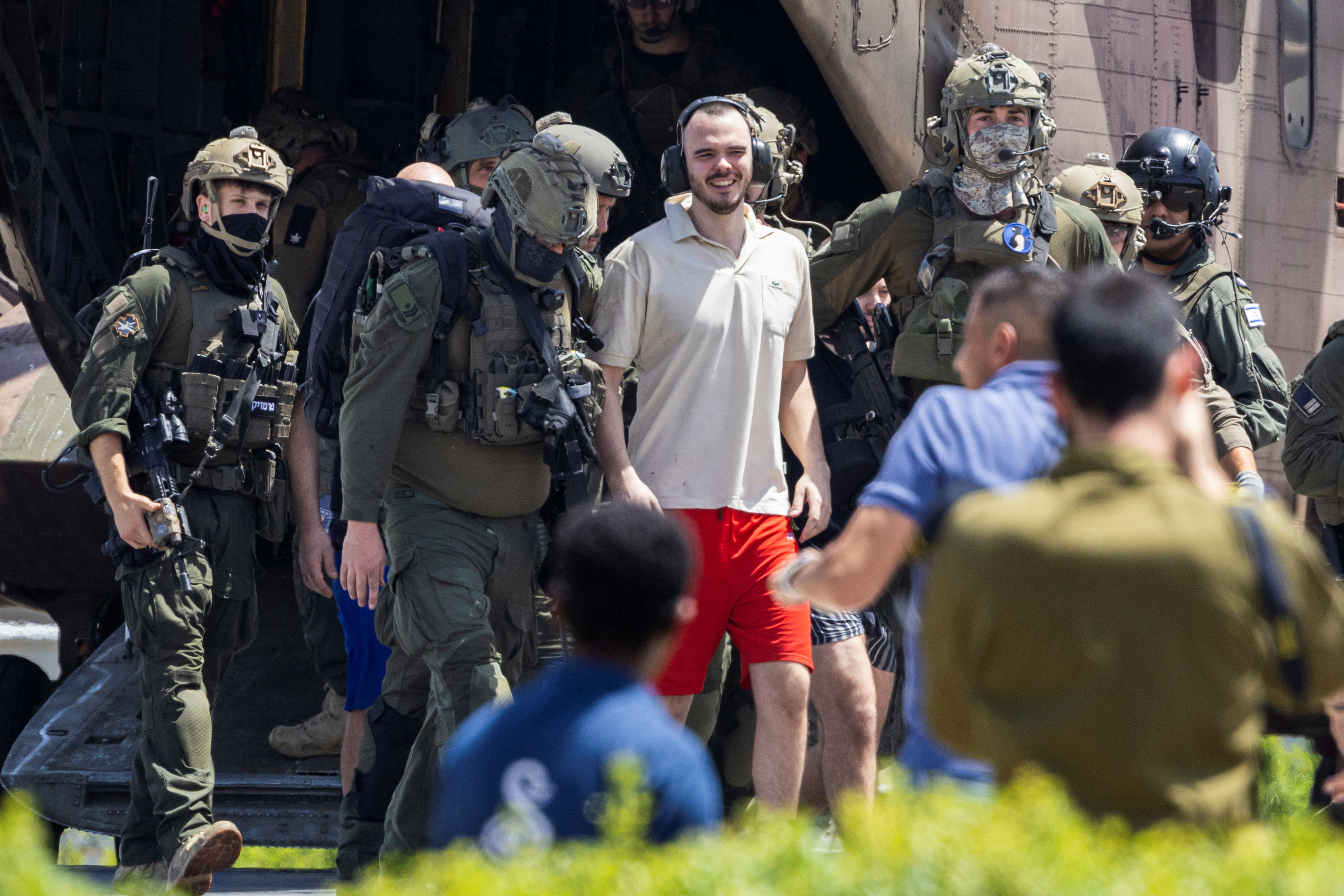 Andrey Kozlov, a released hostage is escorted, in Ramat Gan