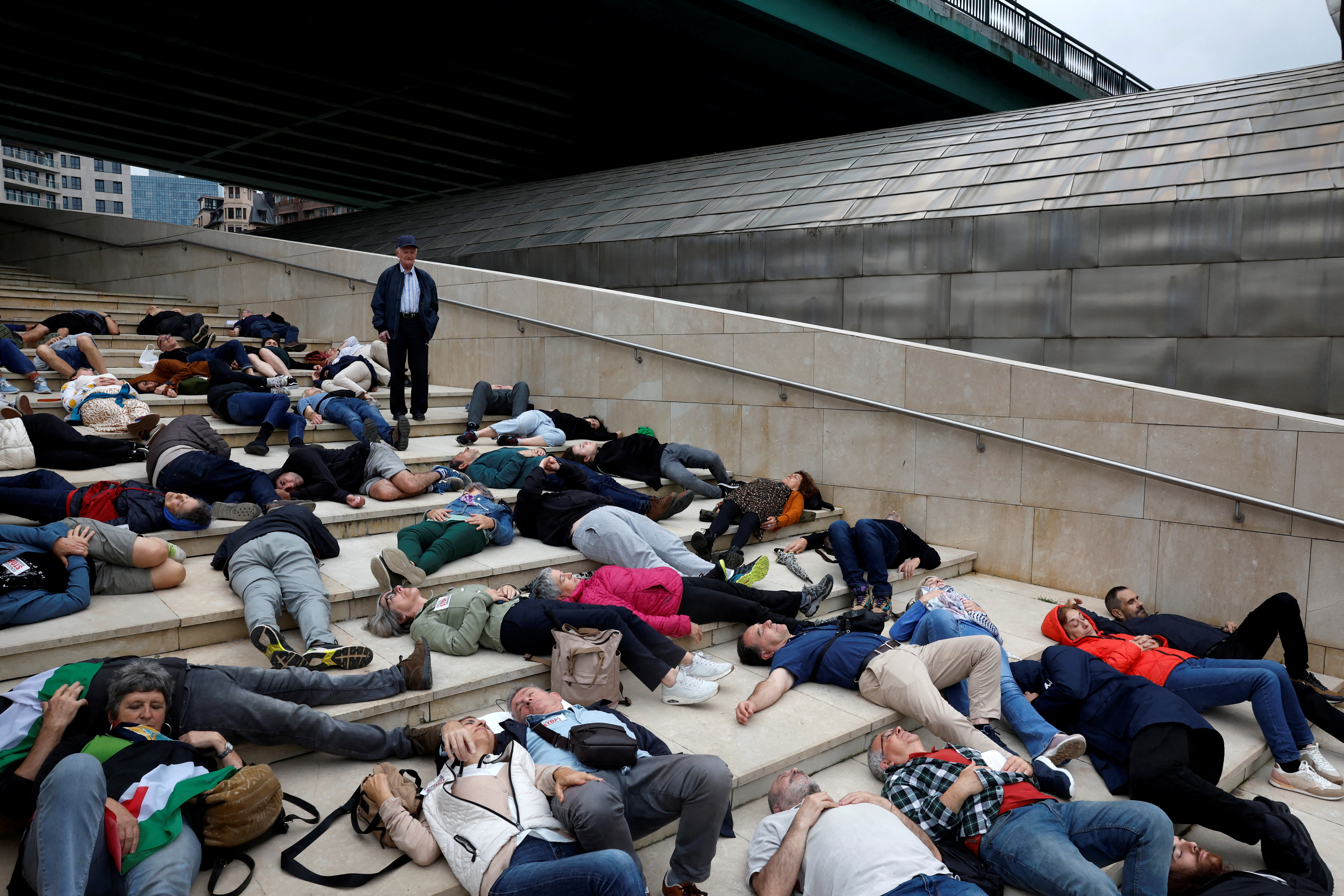 Hundreds of protesters lie down to mimic Gaza casualties at Bilbao's Guggenheim museum