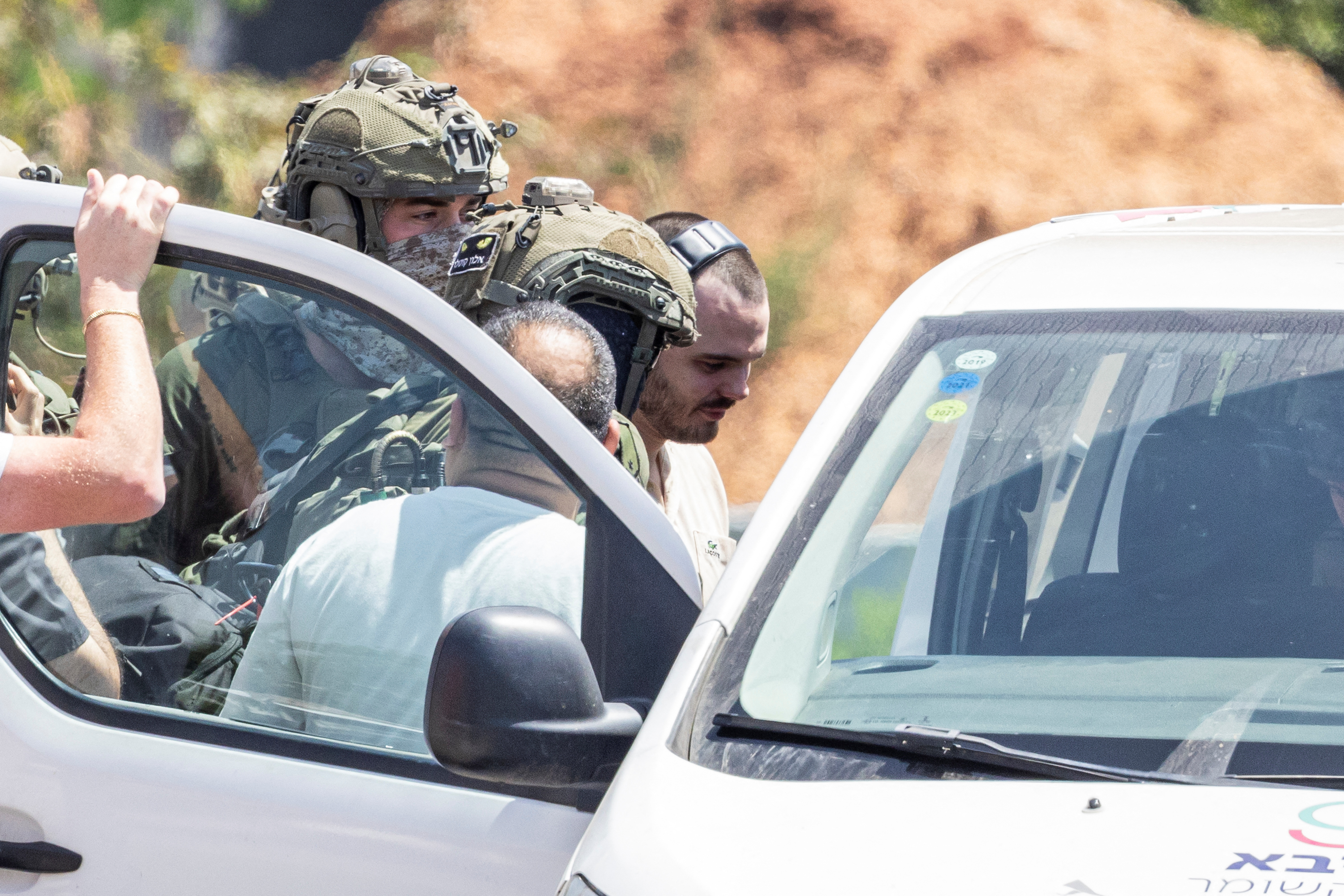 Andrey Kozlov, a released hostage is escorted, in Ramat Gan