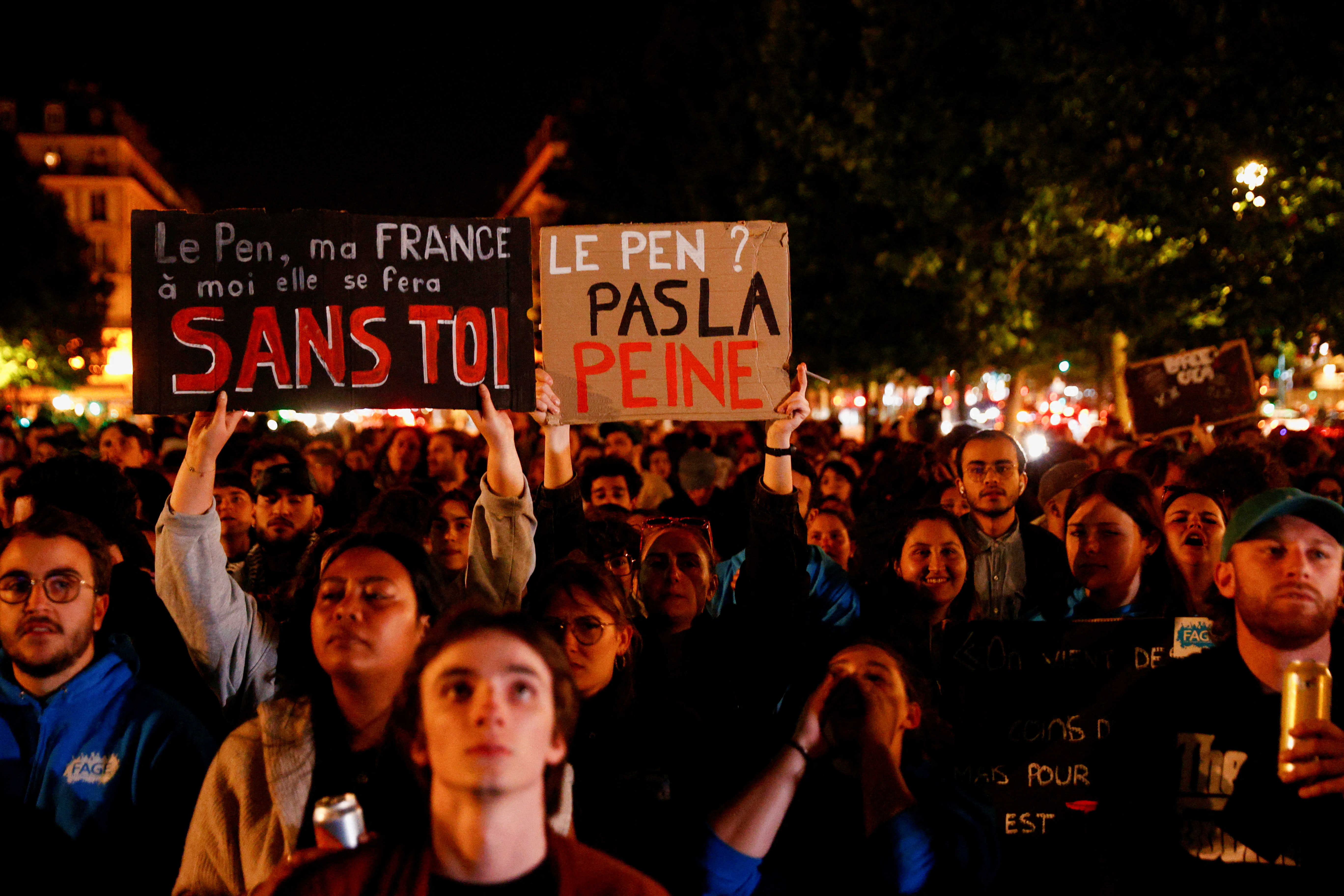 FILE PHOTO: People gather on the Place de Republique following the results of the European elections, in Paris