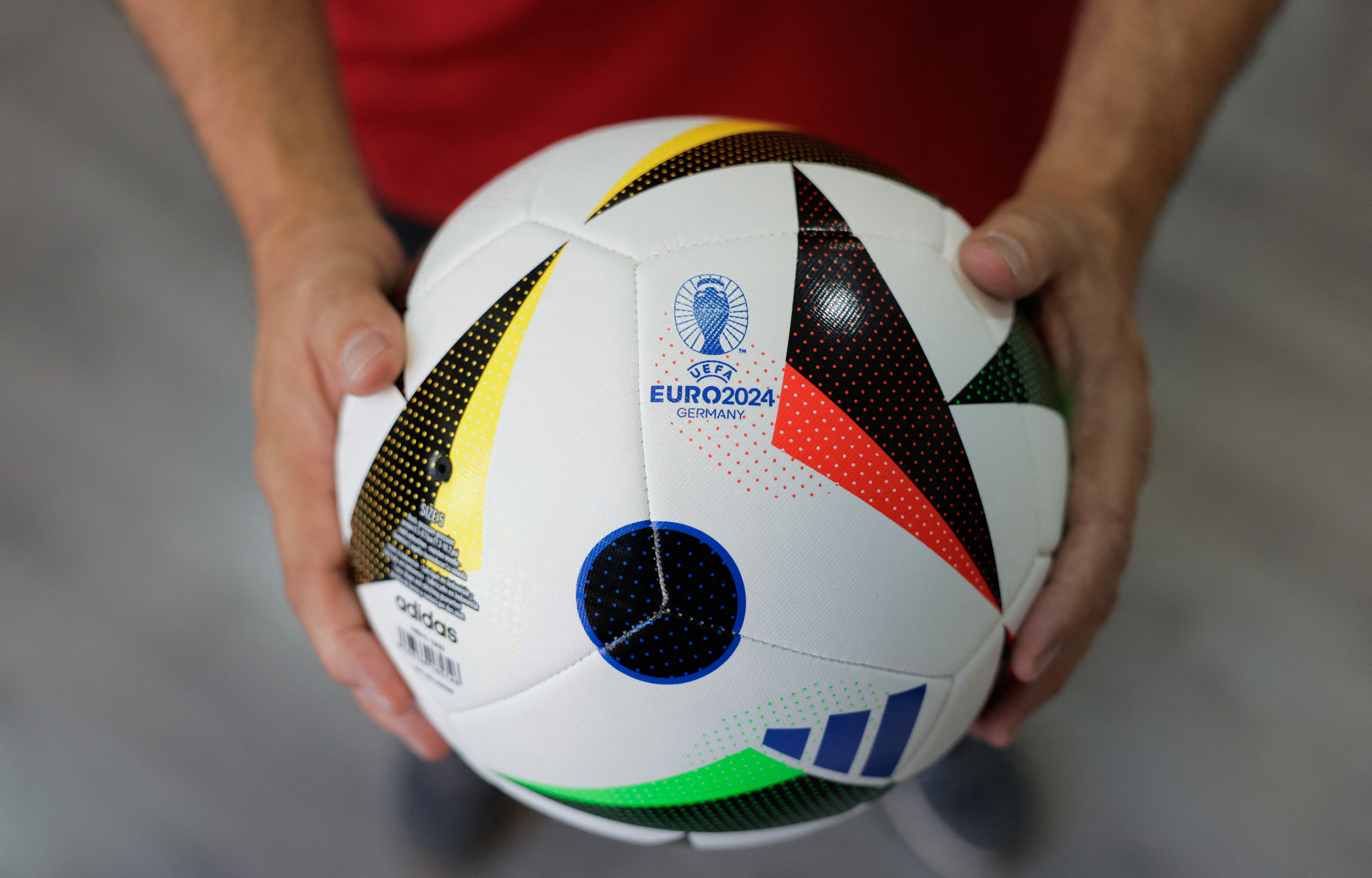 Adidas balls printed as the Euro 2024 match ball 'Fussballliebe' are displayed in Intersport Cary sports clothing store, in Ronda