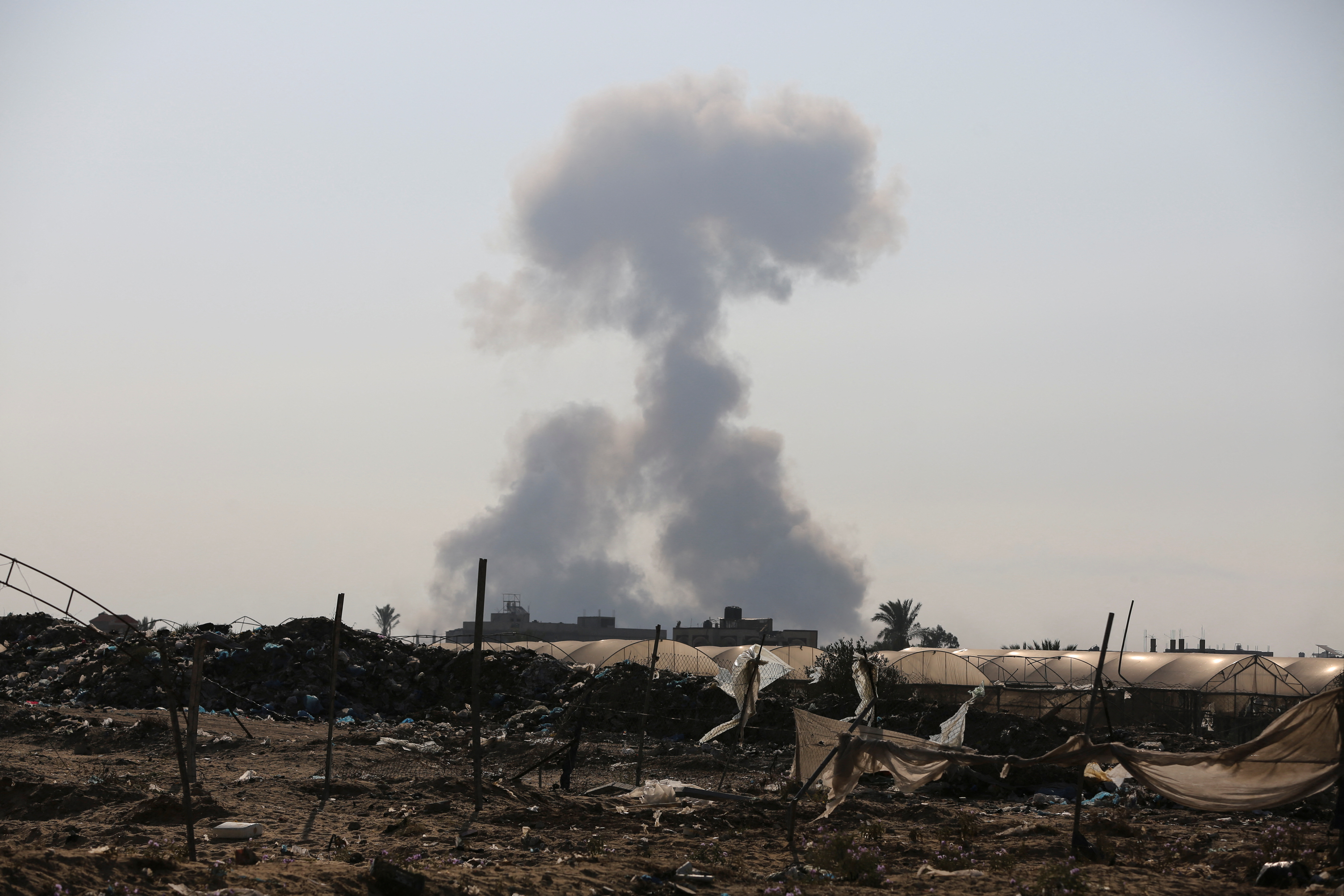 Smoke rises following Israeli strikes, in Khan Younis