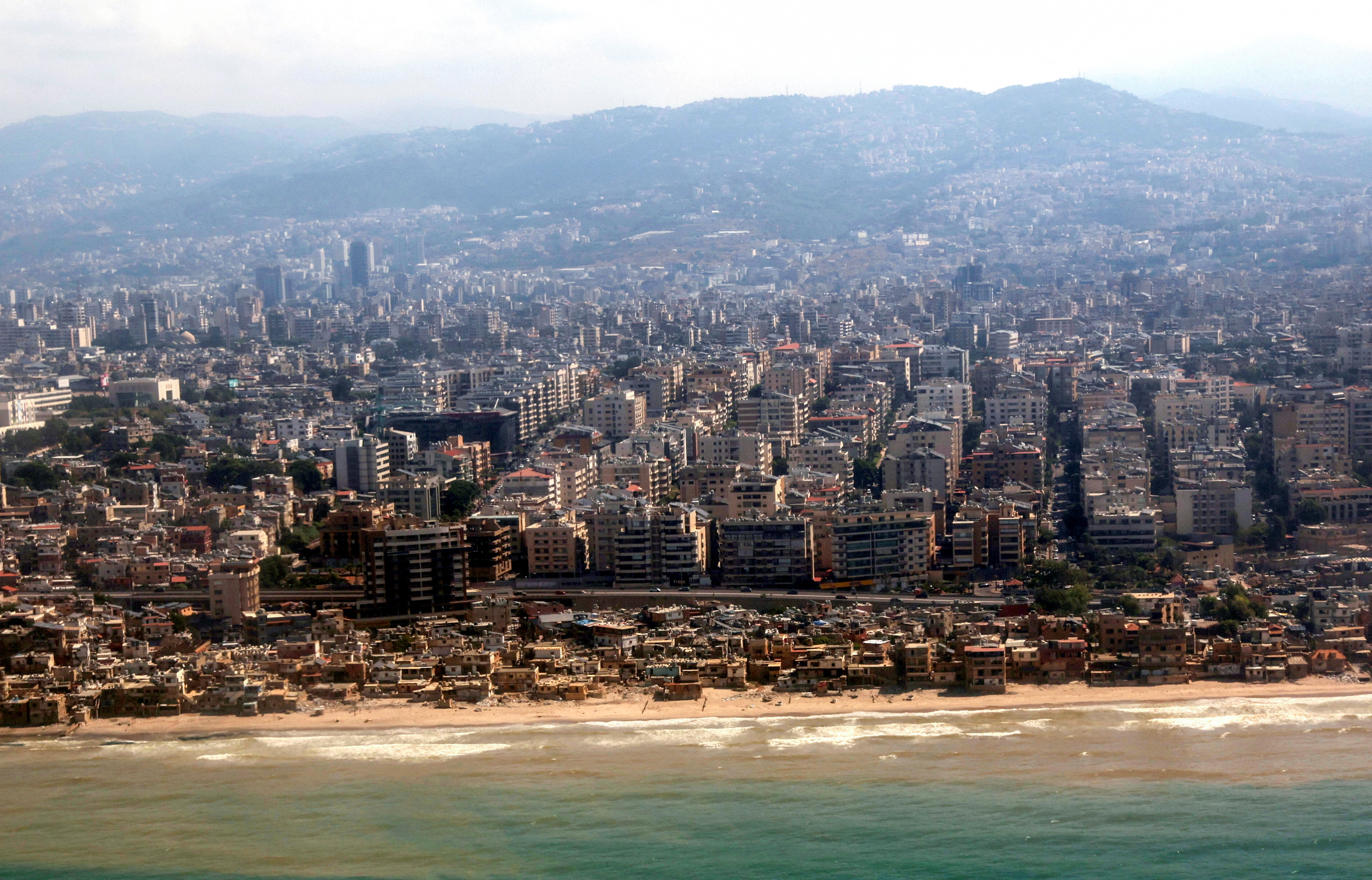 An aerial view from an airplane window shows the coast at the Lebanese capital Beirut