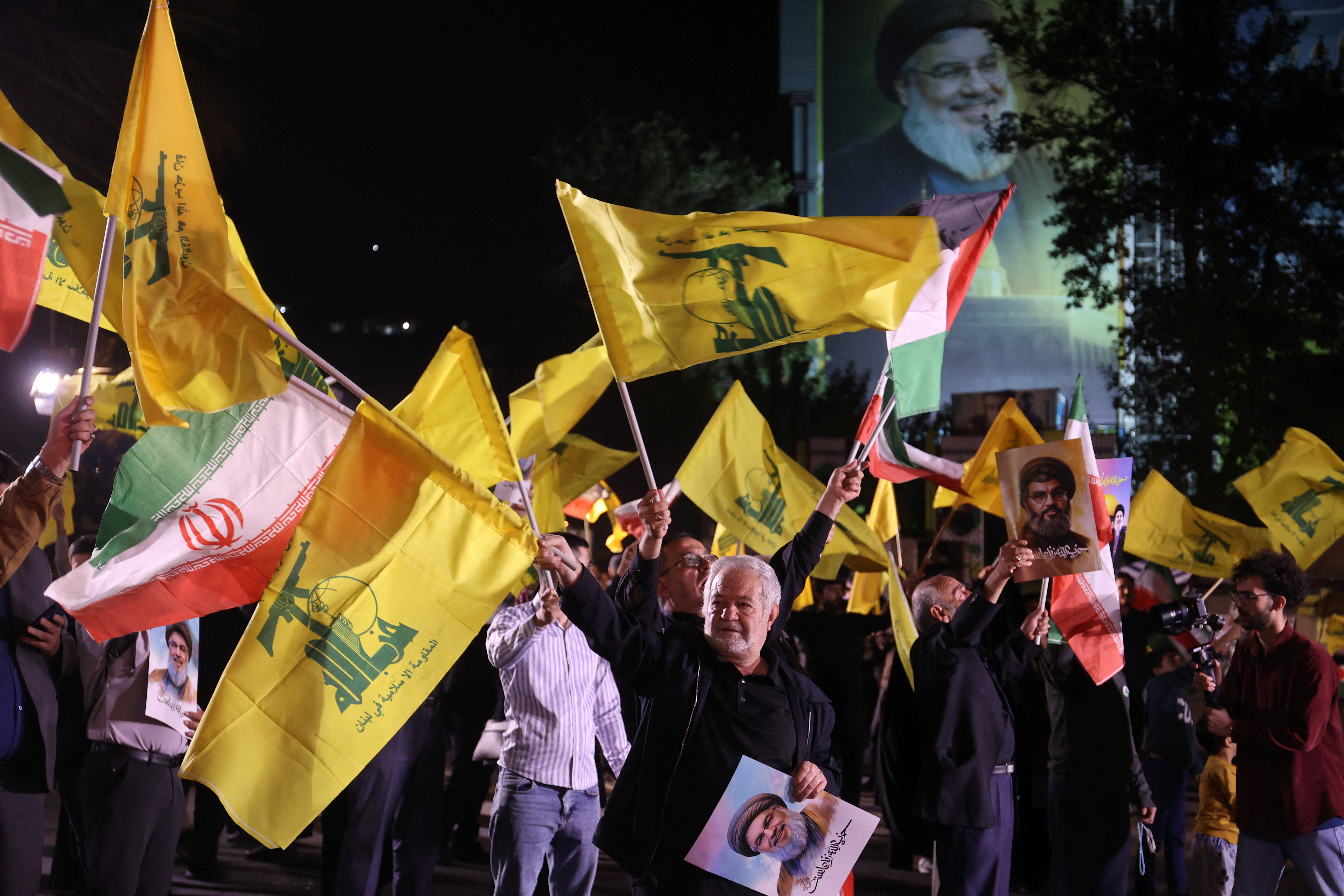 Iranians celebrate on a street, after the IRGC attack on Israel, in Tehran
