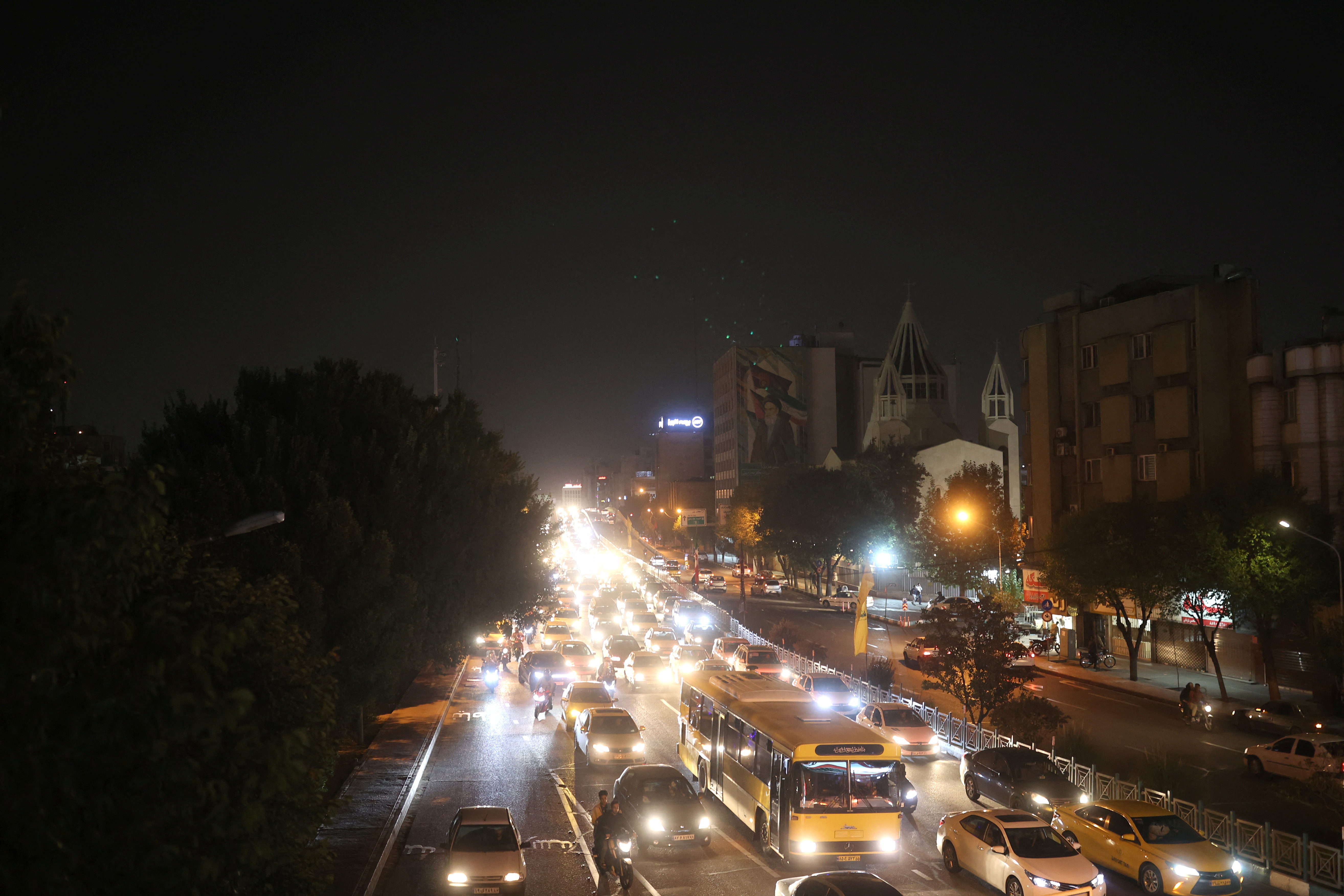 Iranians celebrate on a street, after the IRGC attack on Israel, in Tehran