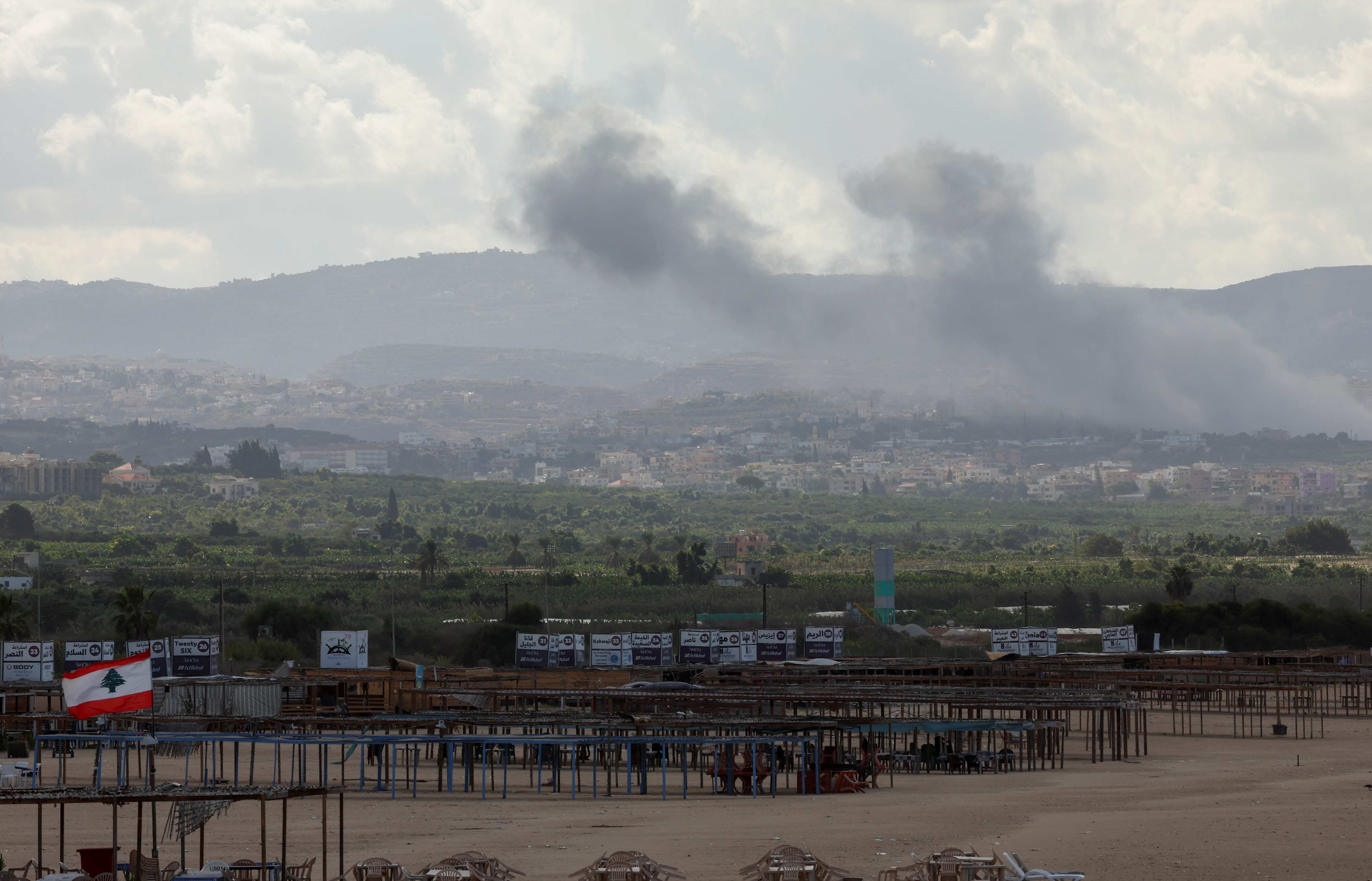 Smoke billows amid the ongoing hostilities between Hezbollah and Israeli forces, as seen from Tyre