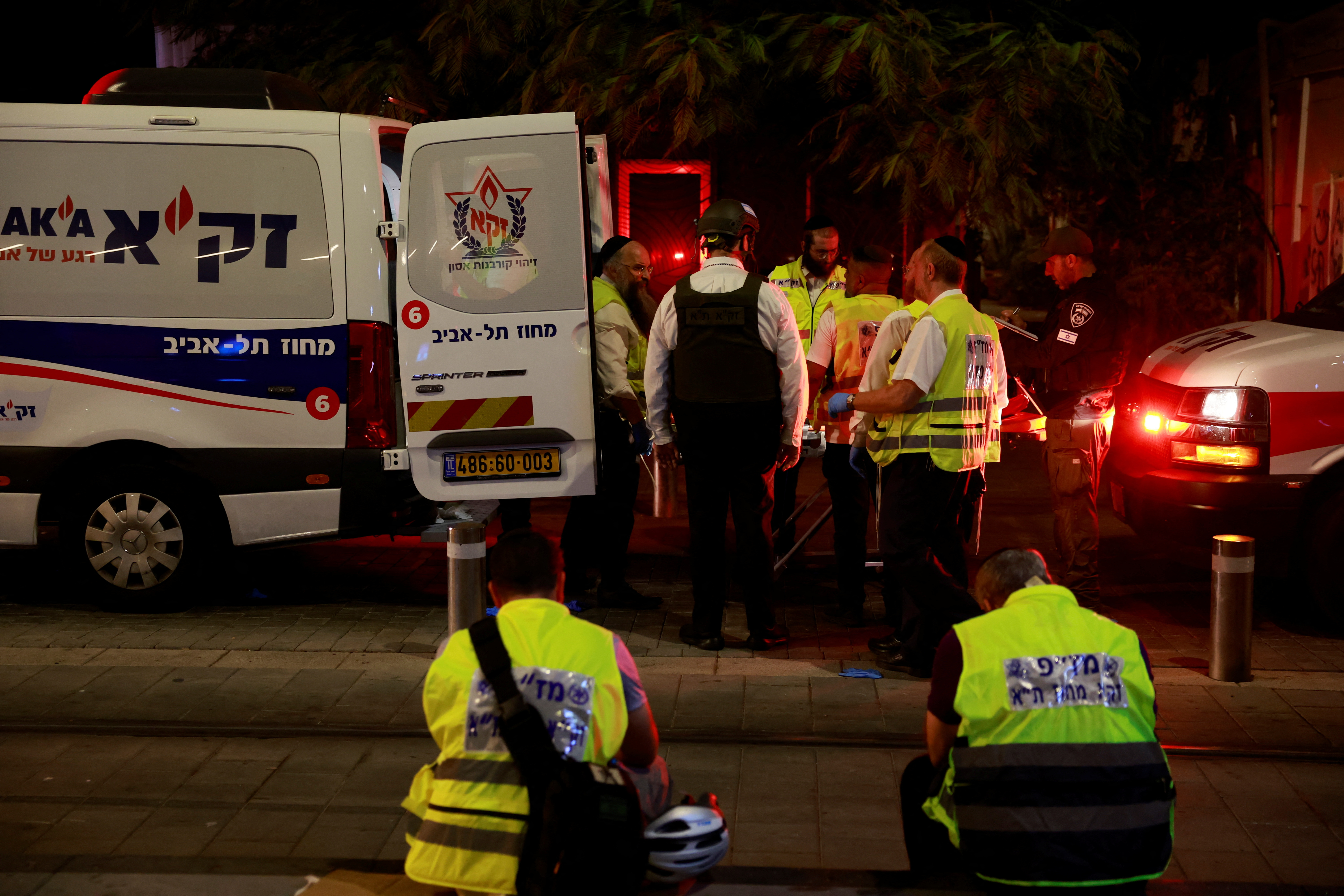Israeli emergency services work, on the day of a shooting attack, in Jaffa