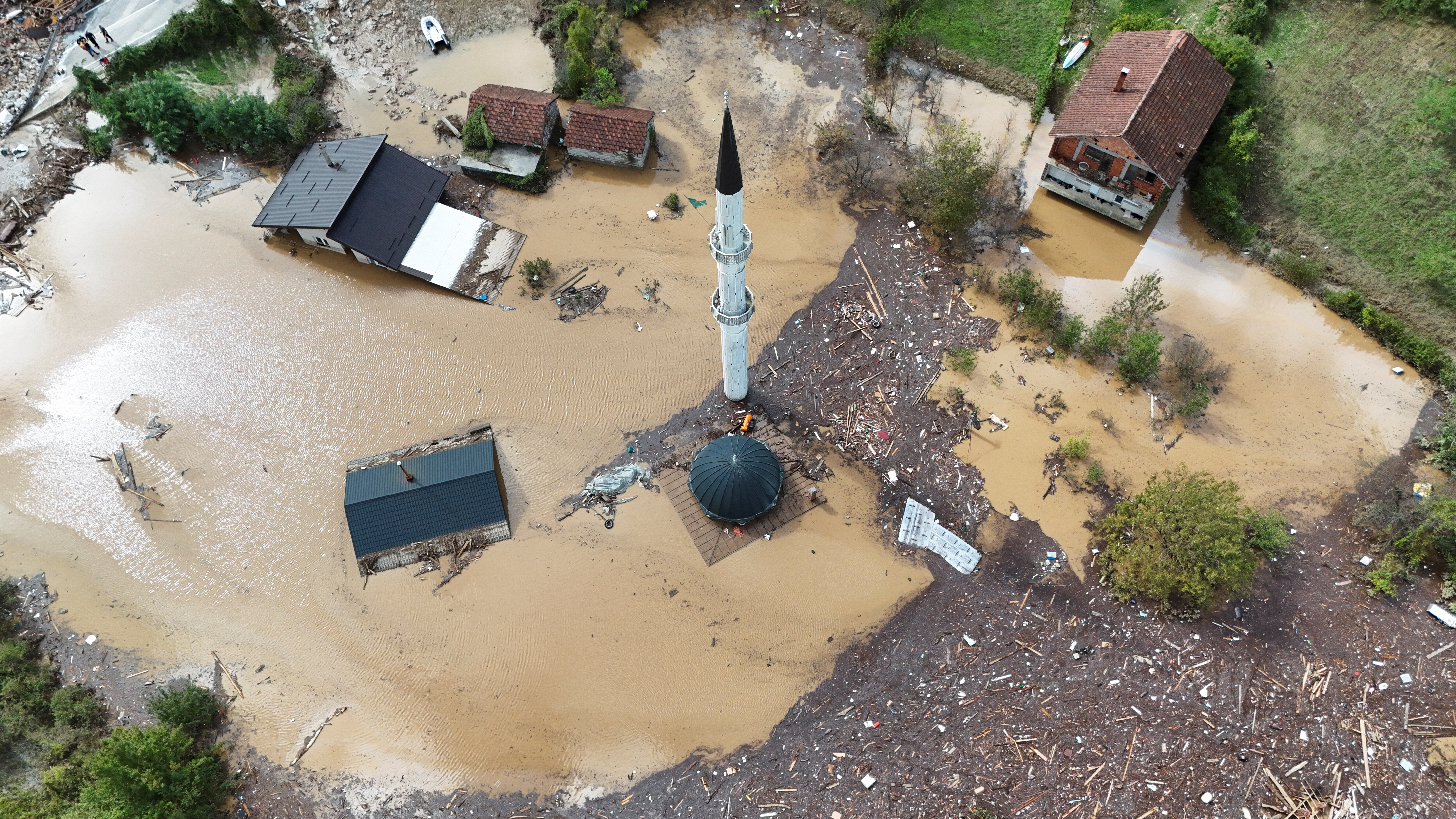 A drone view shows a flooded residential area and mosque in Donja Jablanica