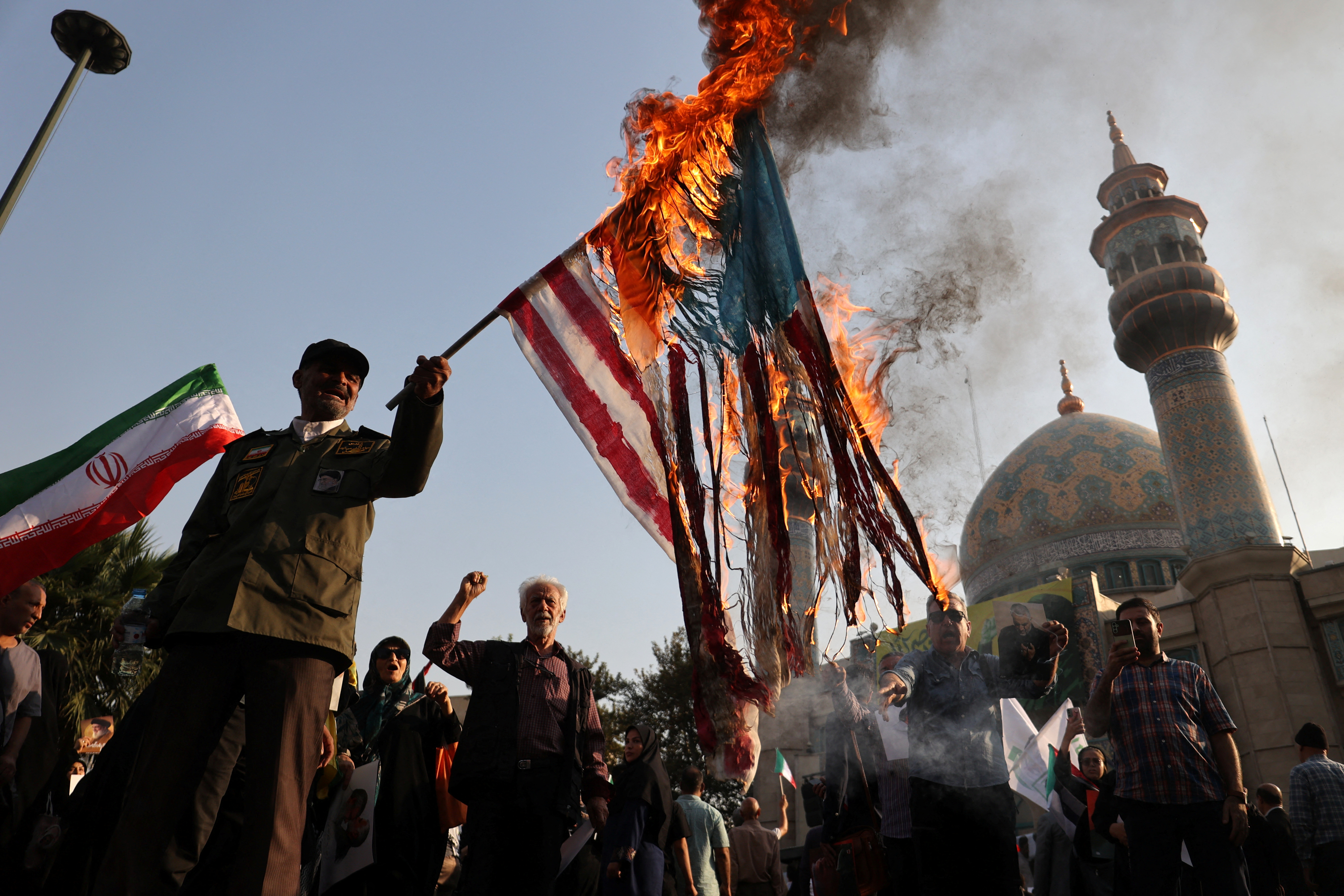 Iranians attend an anti-Israel gathering in Tehran