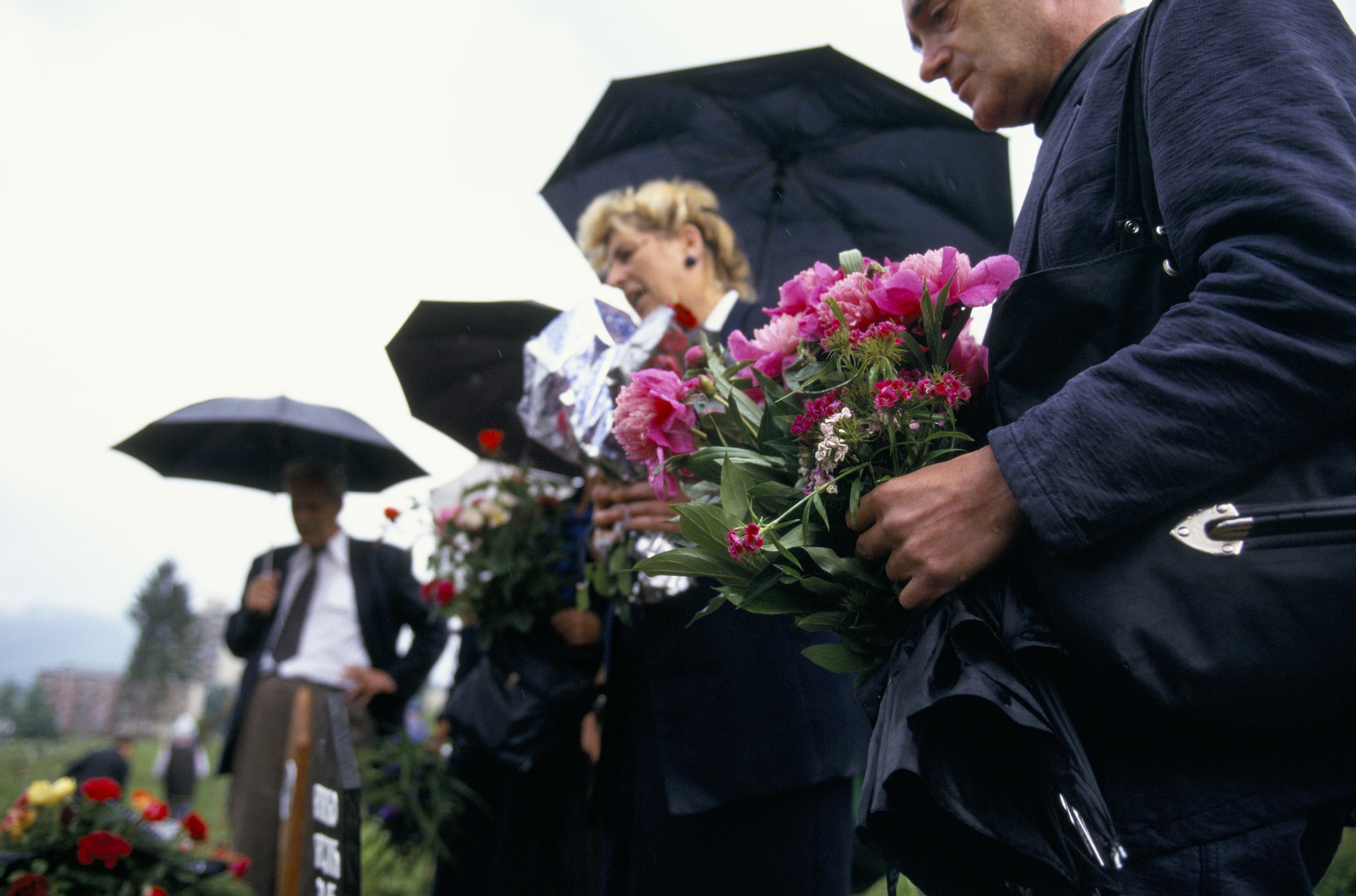 sarajevo june 1995 mourners in black with flowers at a funeral