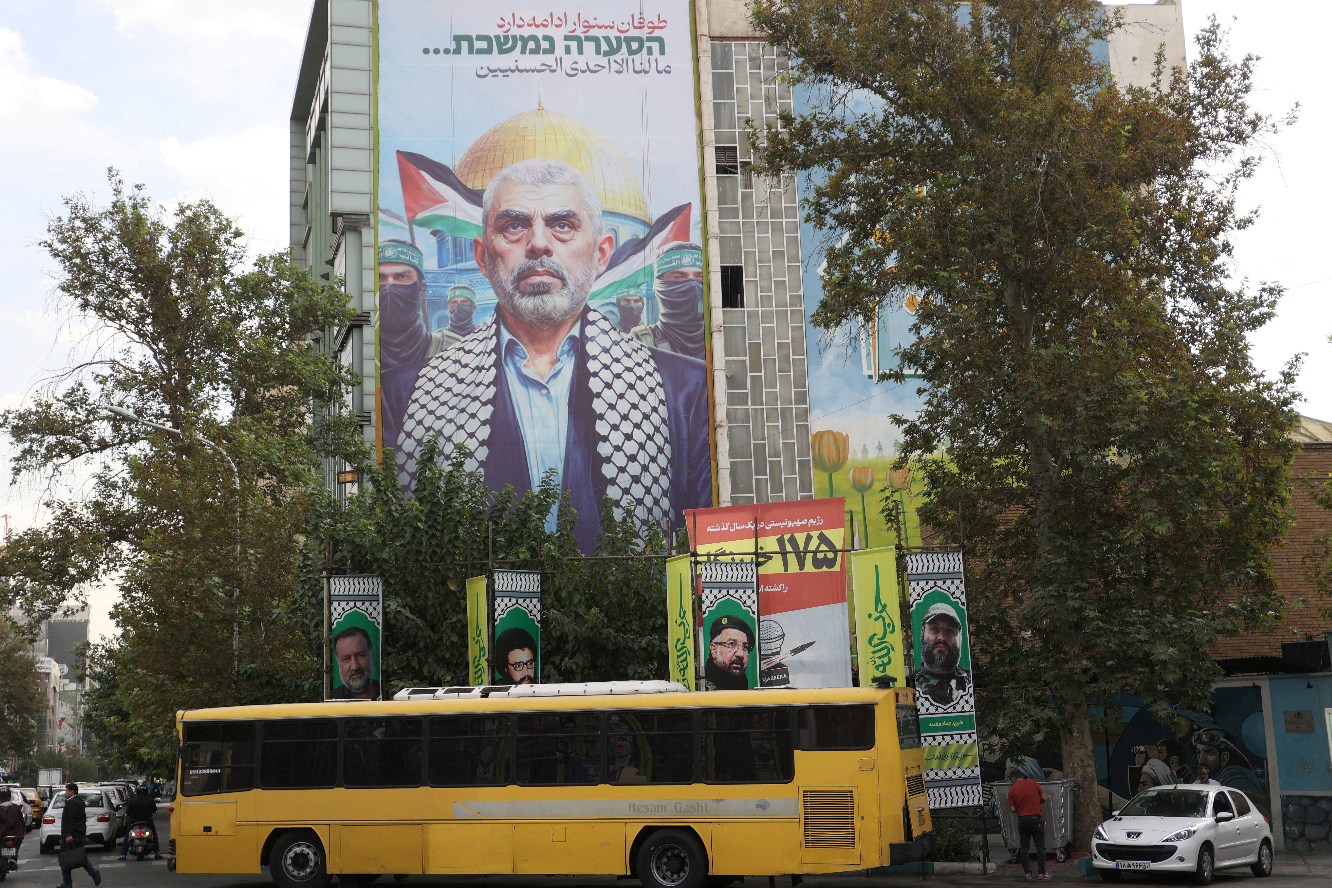 A billboard with a picture of the late Hamas leader Yahya Sinwar is displayed on a building in Tehran