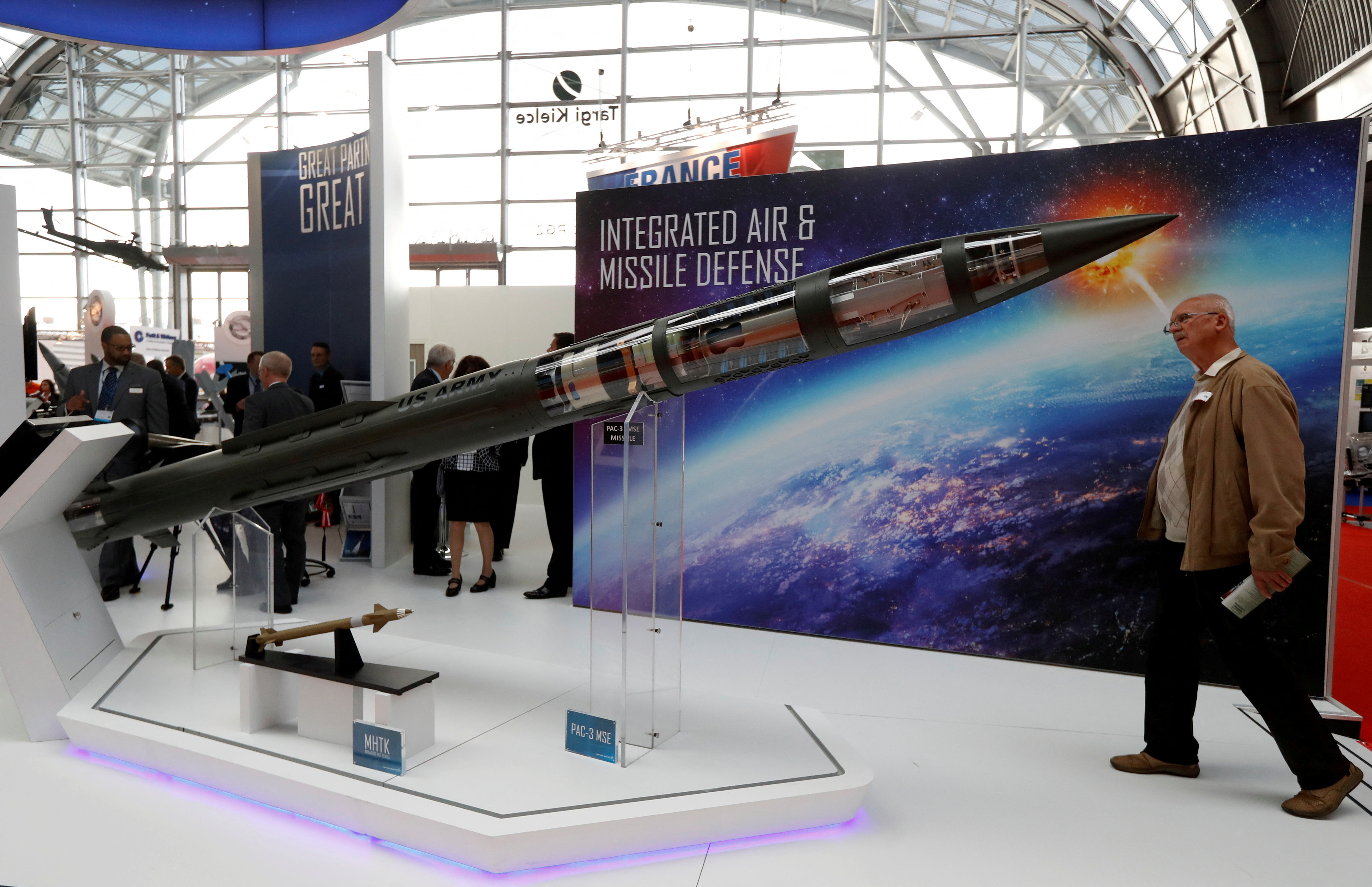 FILE PHOTO: A man looks at a Patriot Advanced Capability (PAC-3) Missile Segment Enhancement (MSE) model by Lockheed Martin at an international military fair in Kielce