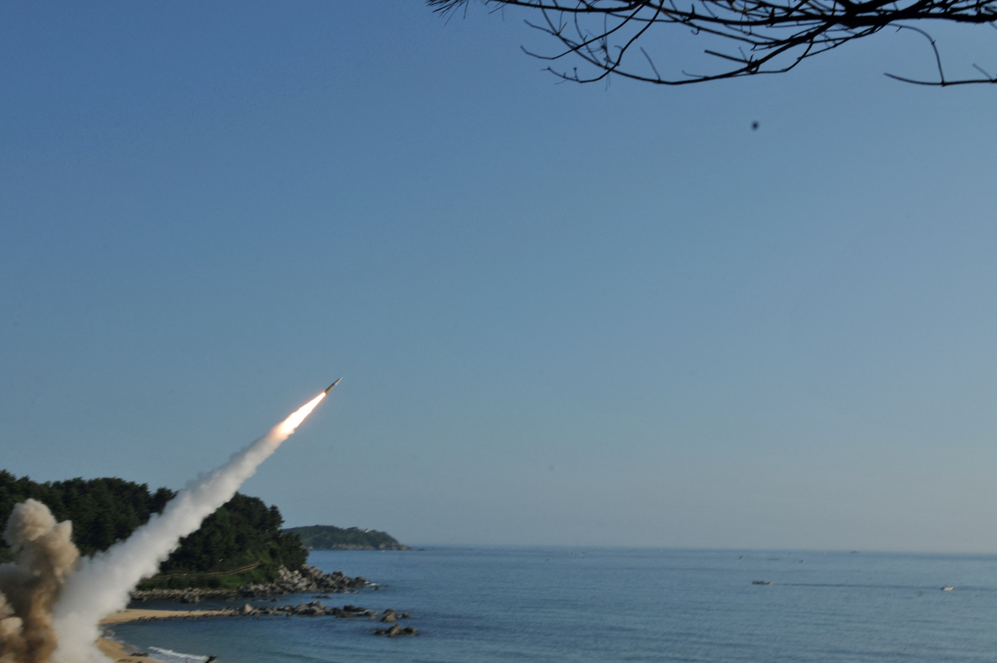 FILE PHOTO: Handout of United States and South Korean troops utilizing the Army Tactical Missile System (ATACMS) and South Korea's Hyunmoo Missile II, fire missiles into the waters of the East Sea, off South Korea