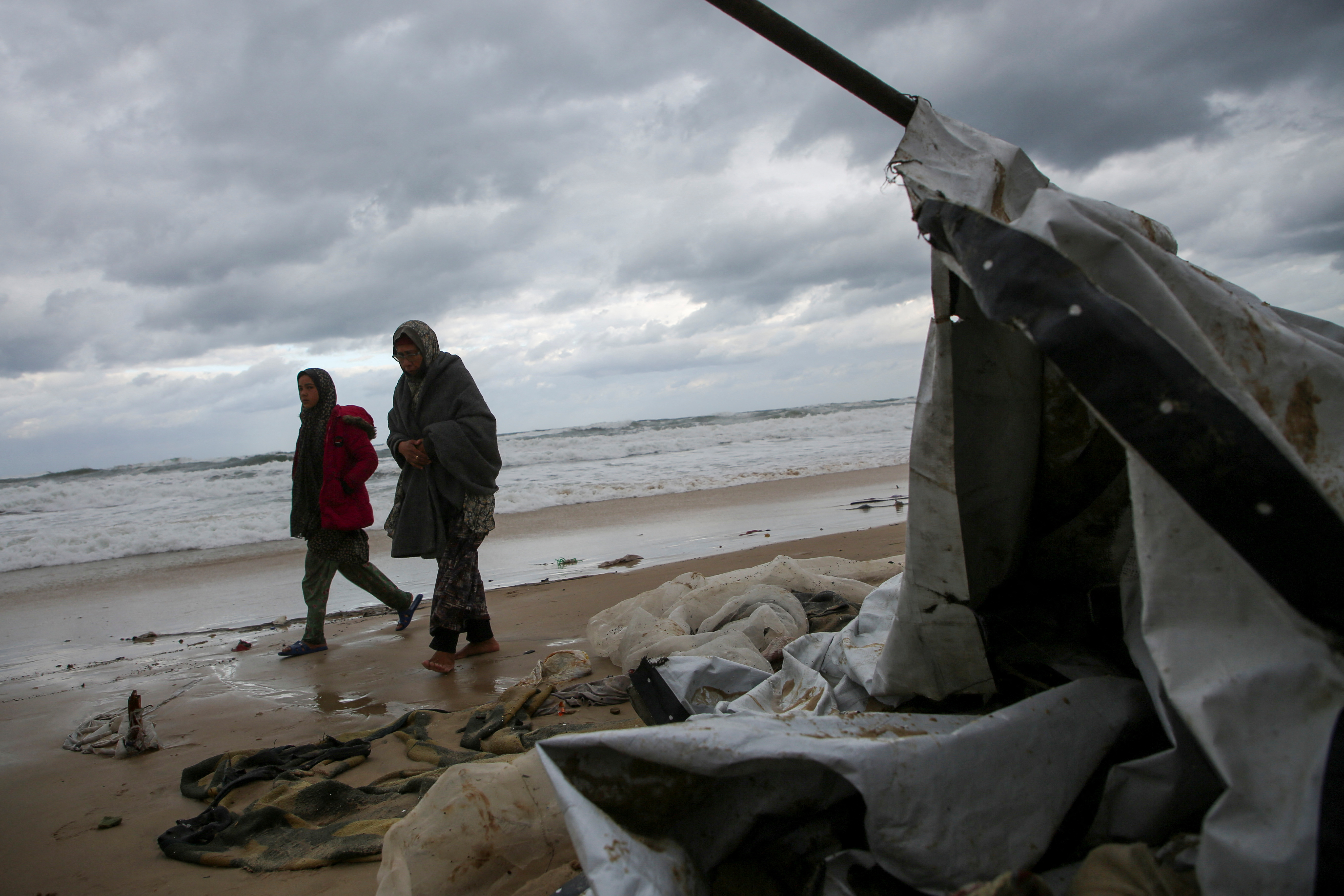 Heavy rains and rising sea levels flood the tents of displaced Palestinians in Gaza's Khan Younis