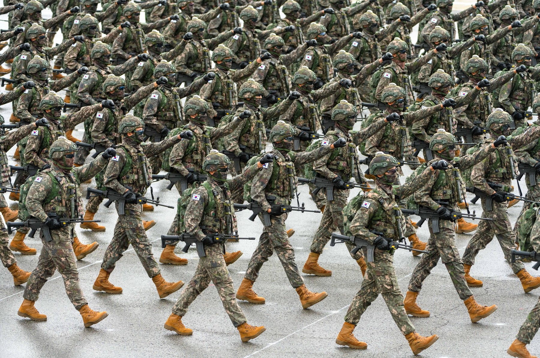 South Korean Army troopers march during a ceremony marking the 76th Armed Forces Day held at Seoul Air Base. South Korean President Yoon Suk Yeol said on October 1 that North Korea will face the end of its regime if it attempts to use nuclear weapons, war