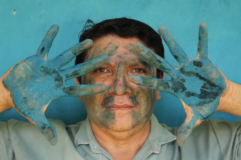 Luis-May-Ku-49-poses-with-his-hands-painted-in-Maya-Blue-outside-his-home-in-Dzan-Yucatan-Mexico-on-9-September-2024_-1731943152