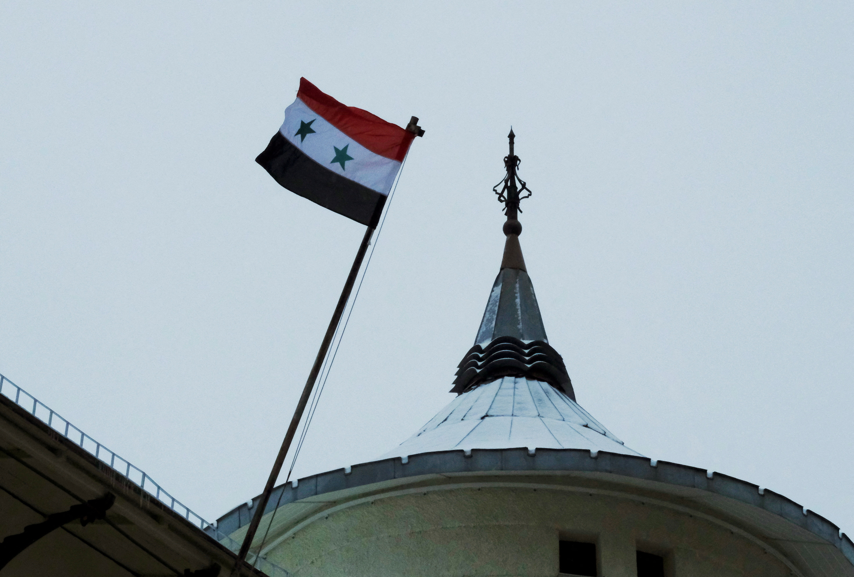 A flag flies above the Syrian embassy in Moscow