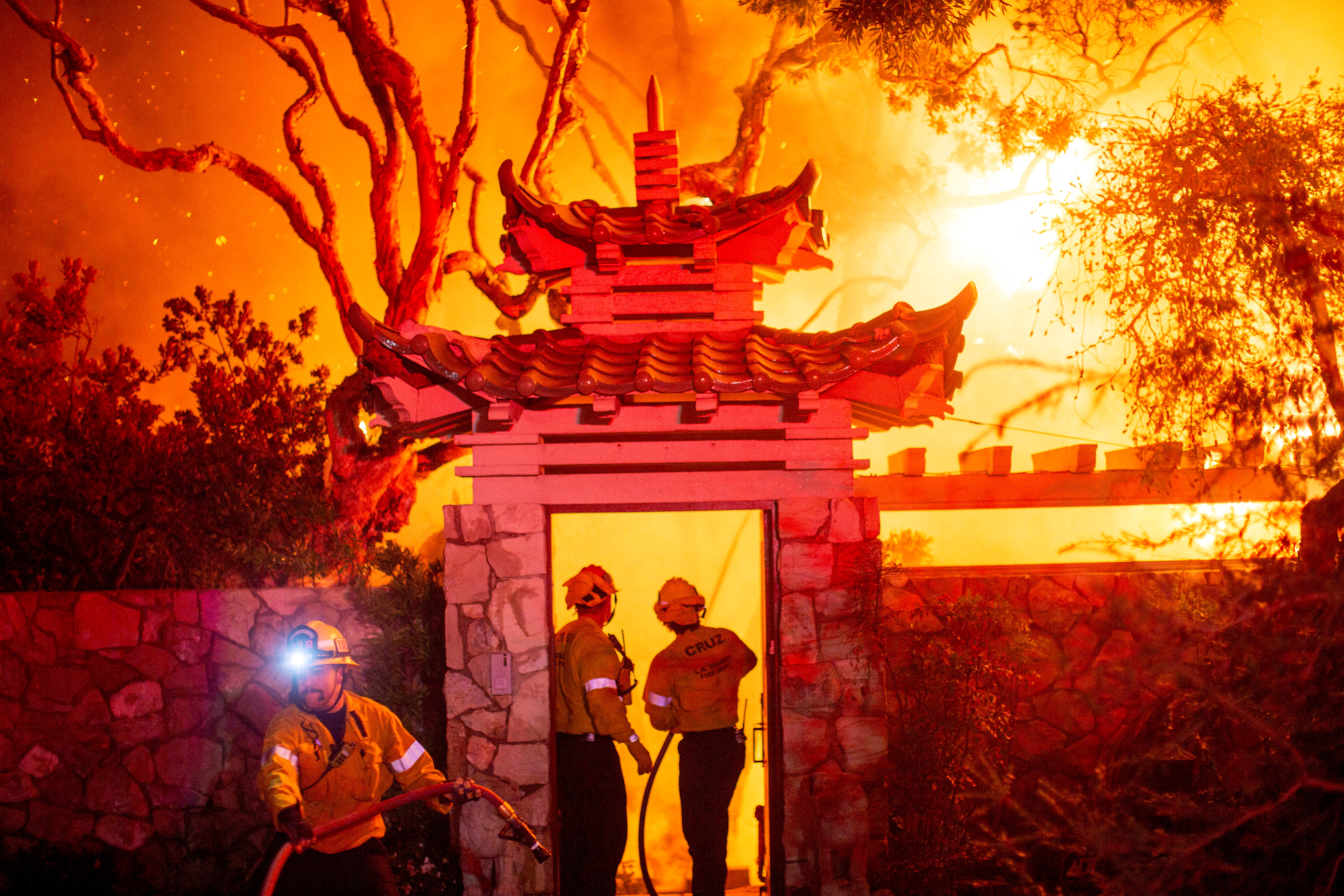 Palisades fire burns during a windstorm on the west side of Los Angeles