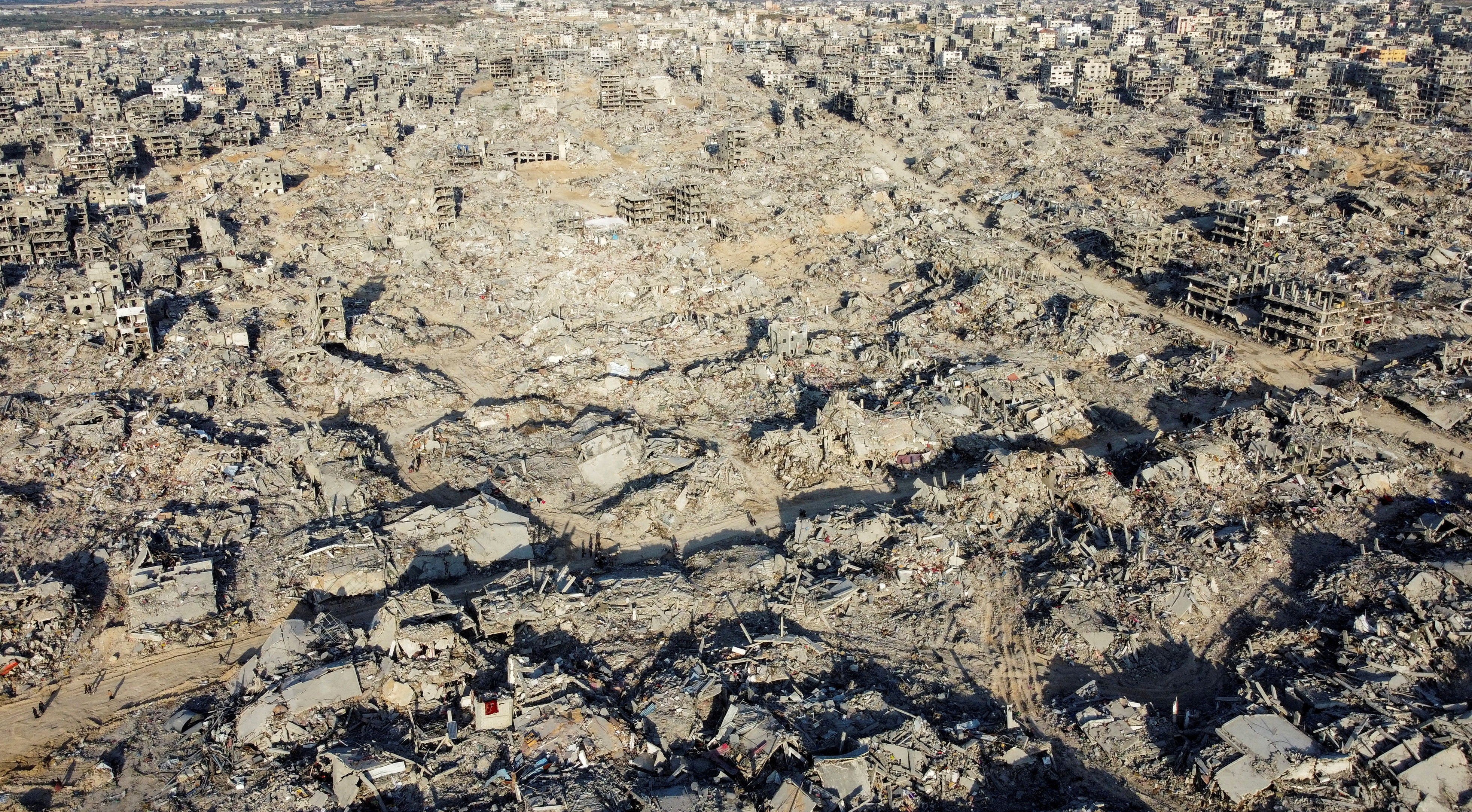 A drone view shows houses and buildings lying in ruins, following a ceasefire between Israel and Hamas, in the northern Gaza Strip
