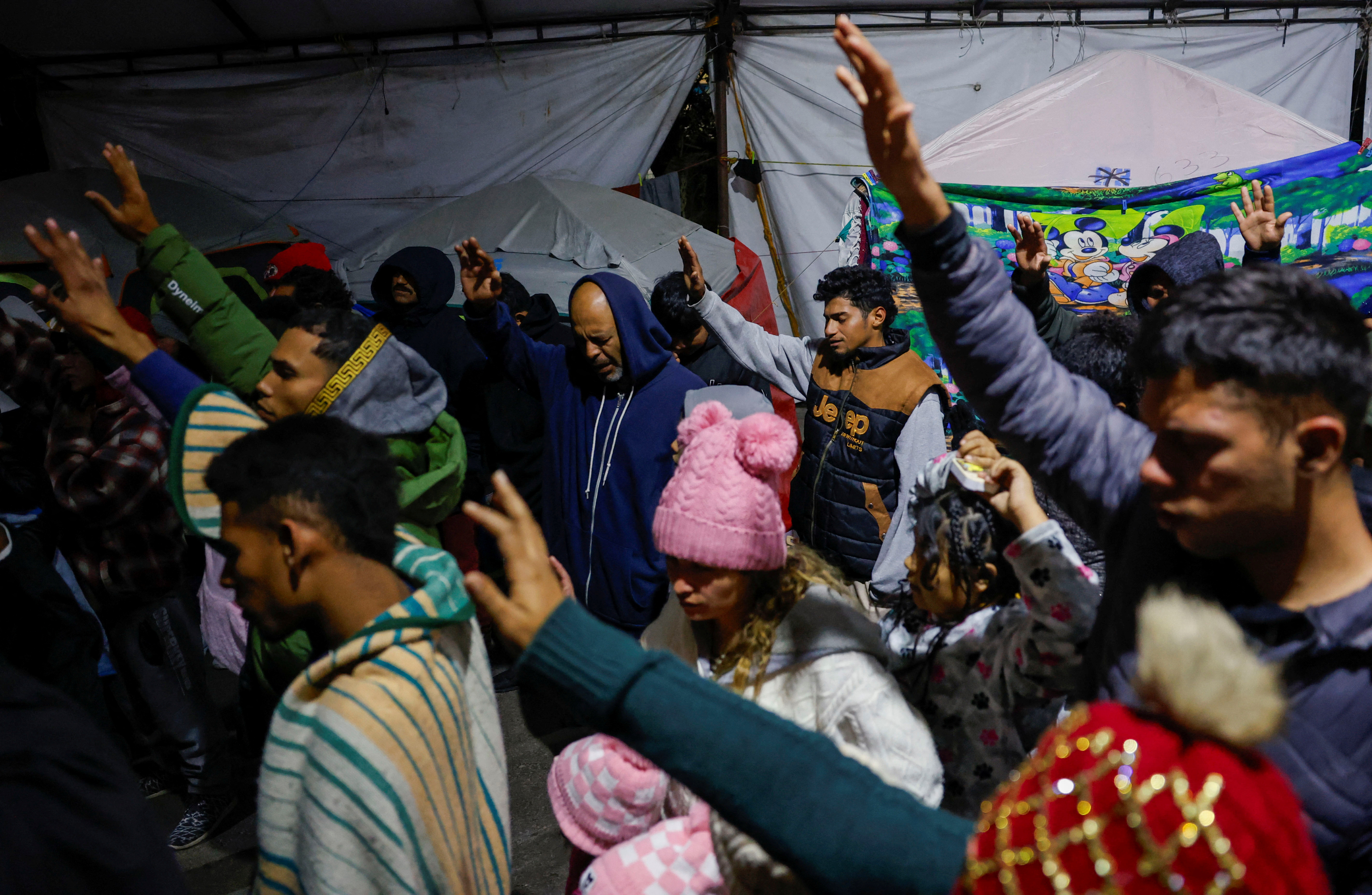 Migrants wait in temporary shelter after CBP One application was shut down, in Matamoros