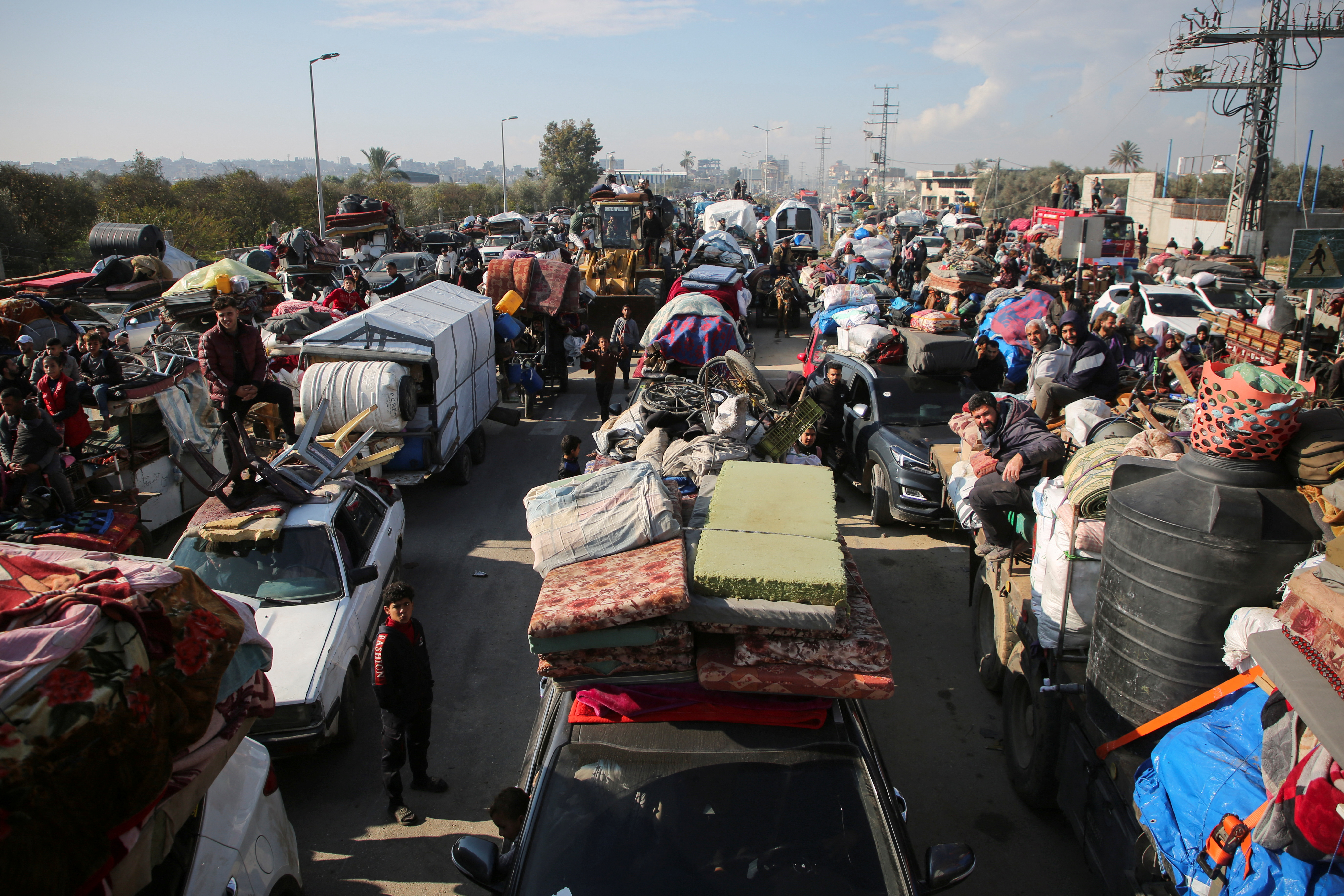 Displaced Palestinians wait to be allowed to return to their homes in northern Gaza, in the central Gaza Strip