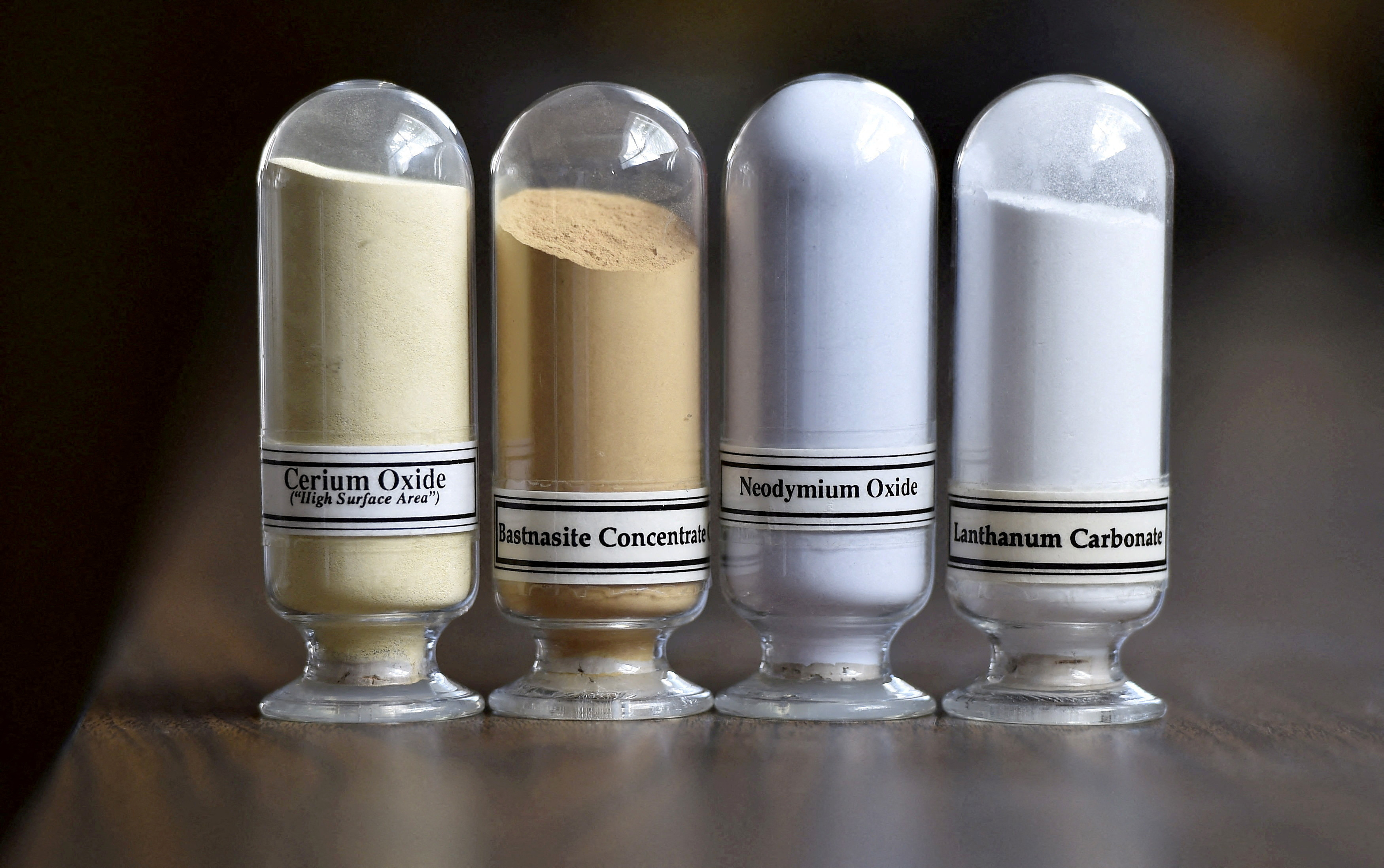 FILE PHOTO: Samples of rare earth minerals, Cerium oxide, Bastnasite, Neodymium oxide and Lanthanum carbonate are on display during a tour of Molycorp's Mountain Pass Rare Earth facility in Mountain Pass, California