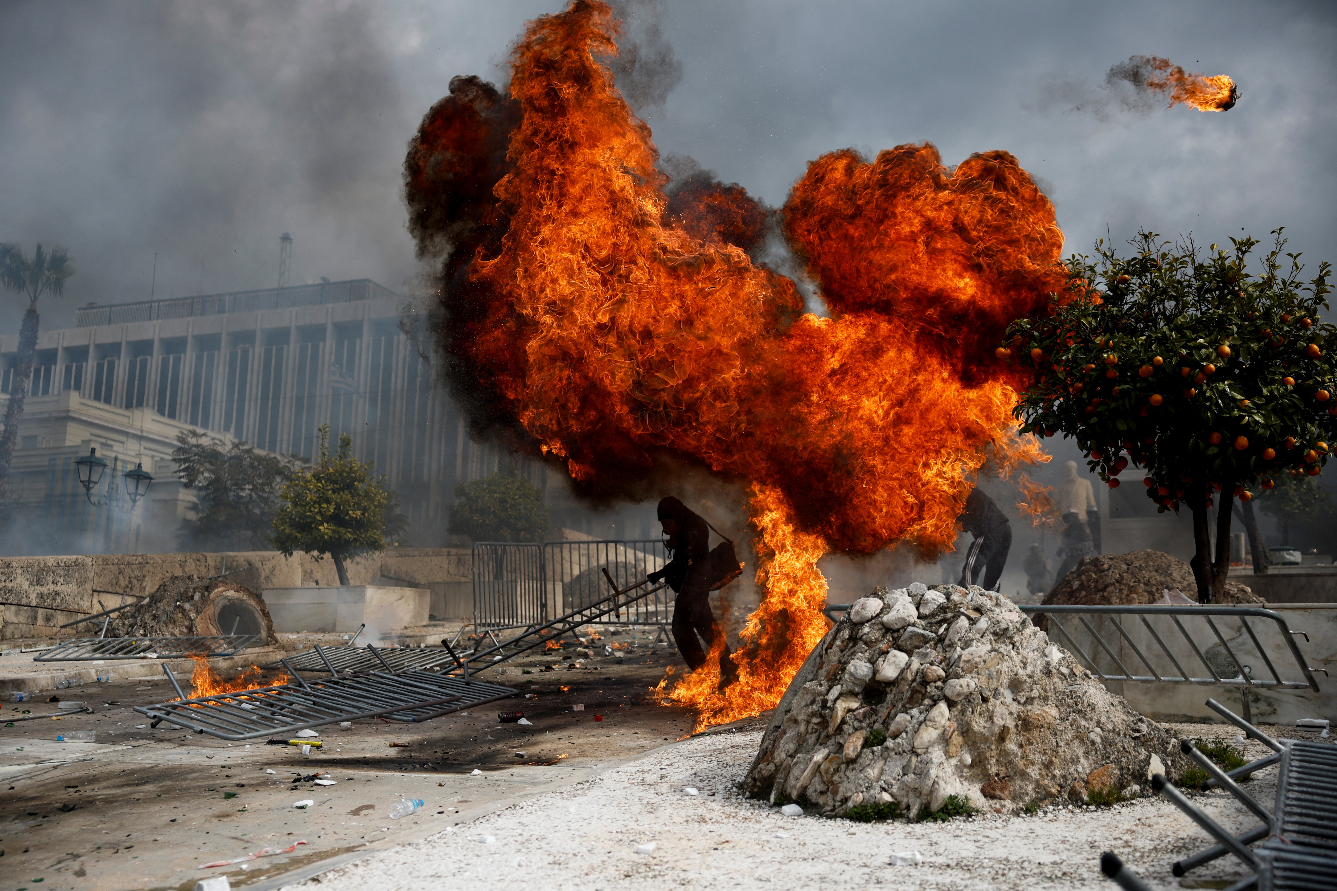 People gather in front of the Greek parliament during a protest, in Athens