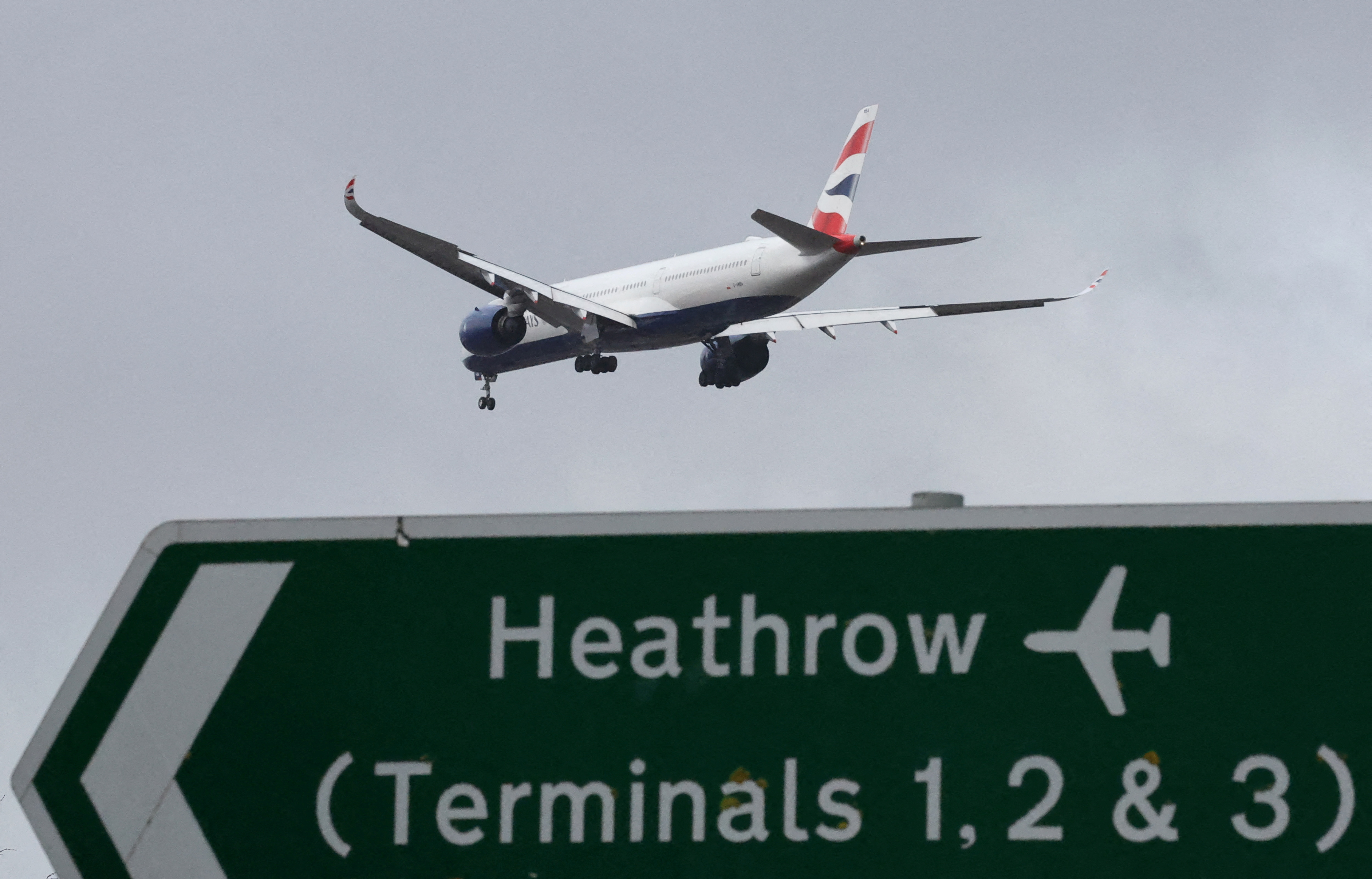 FILE PHOTO: Planes make landing approach to Heathrow Airport in west London