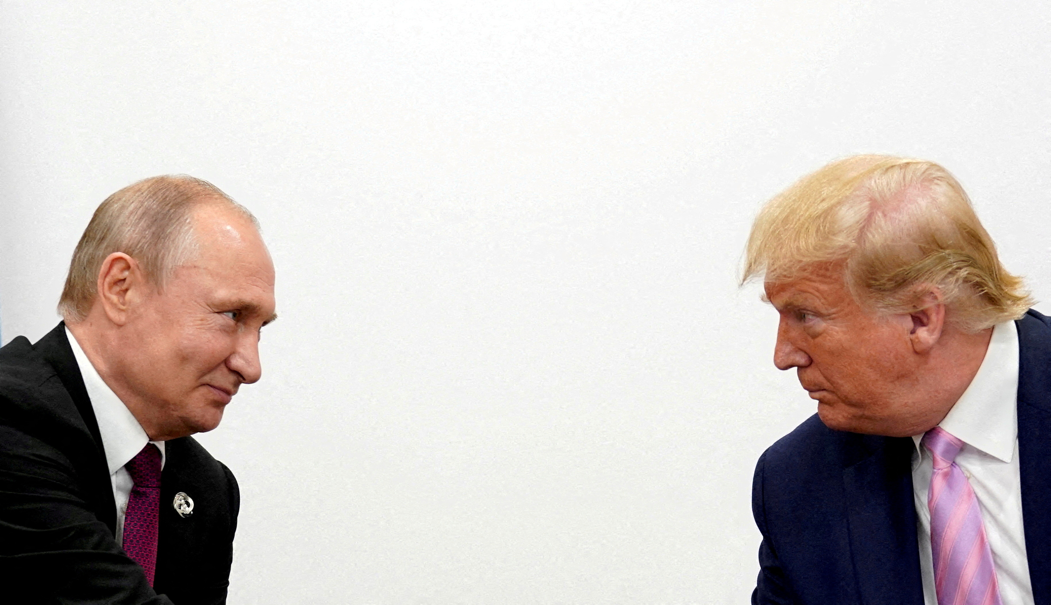 FILE PHOTO: U.S. President Donald Trump and Russian President Vladimir Putin  at G20 leaders summit in Osaka
